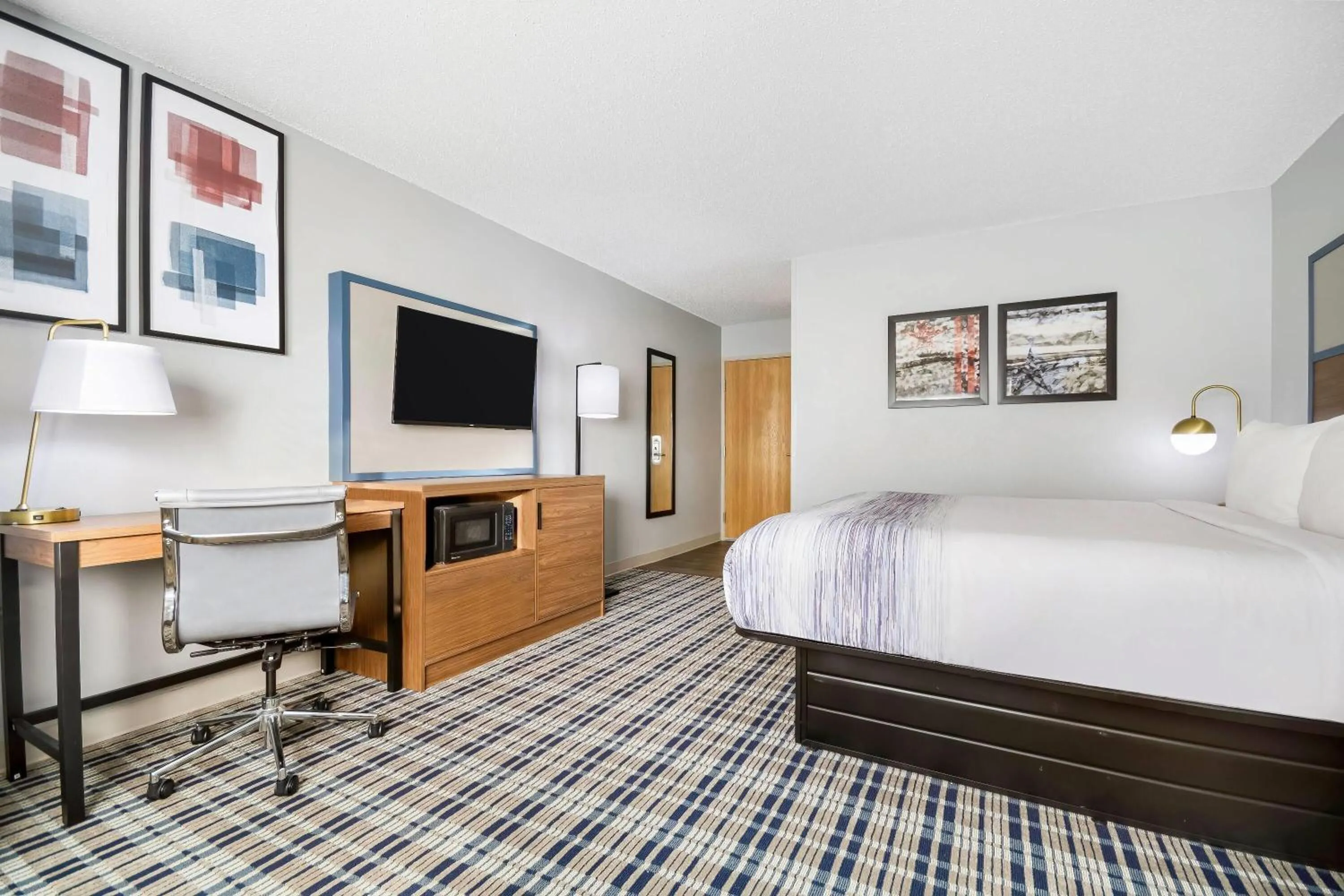 Bed in AmericInn by Wyndham Wausau