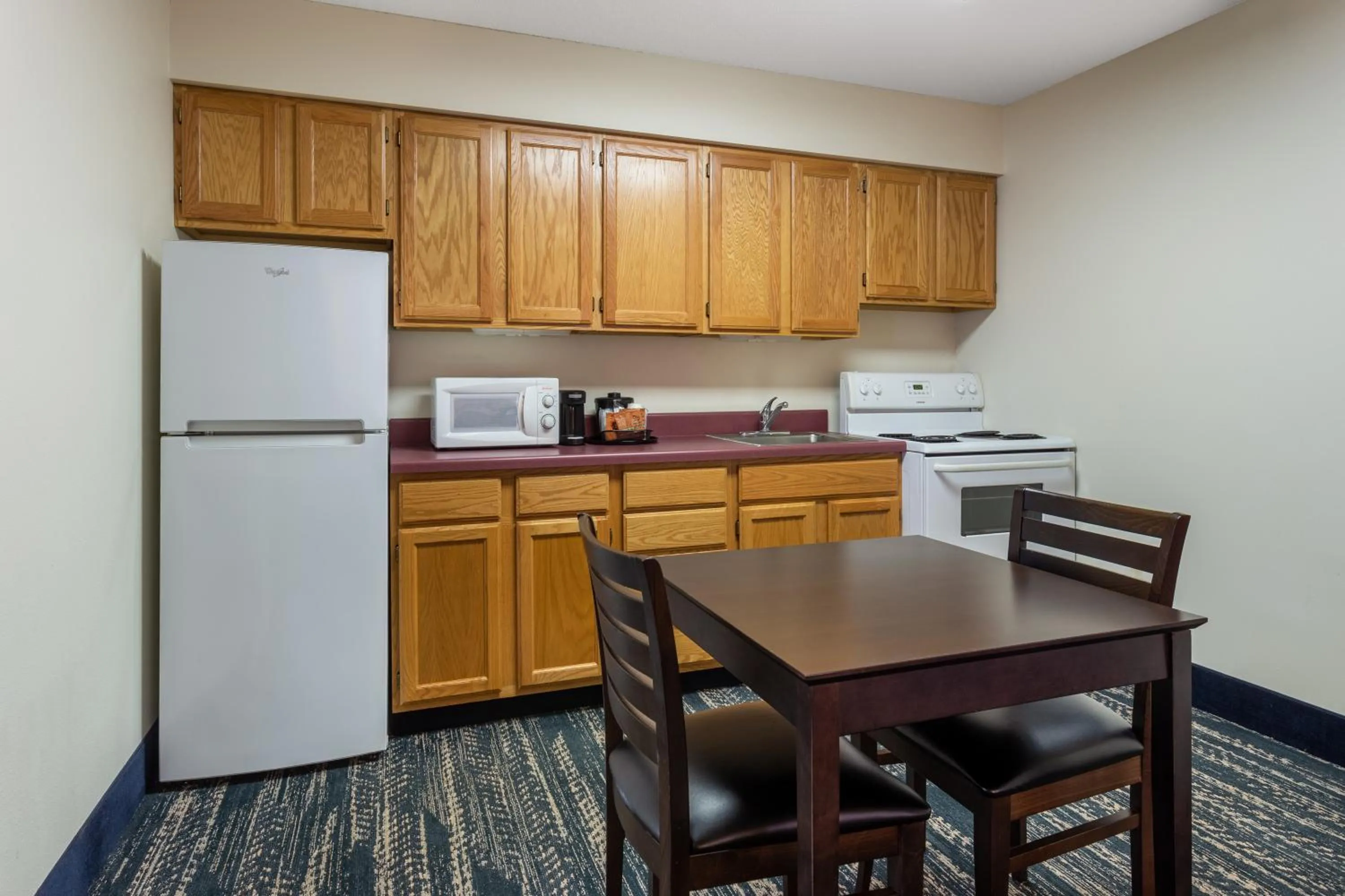 Kitchen or kitchenette in AmericInn by Wyndham Wausau