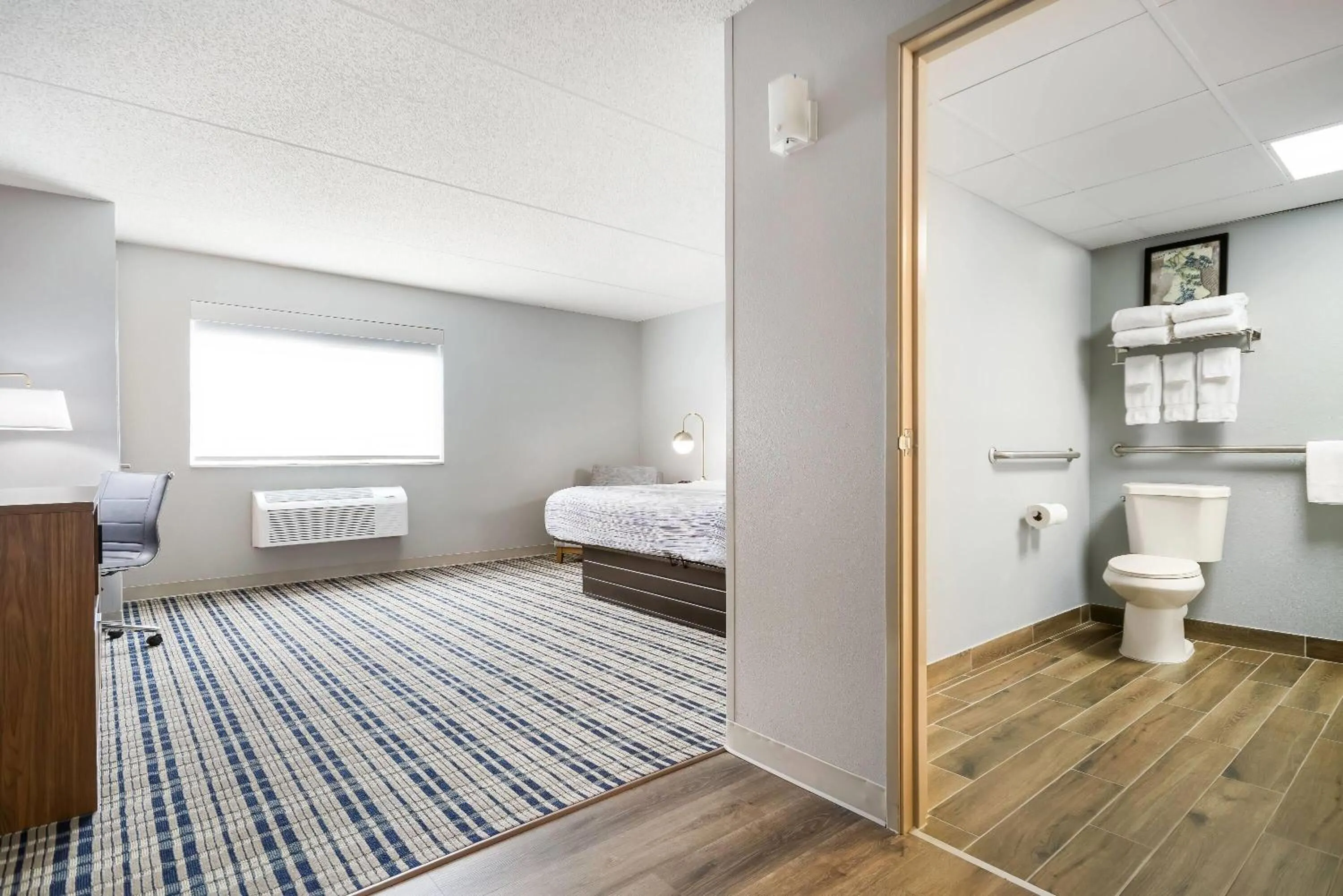 Bed in AmericInn by Wyndham Wausau