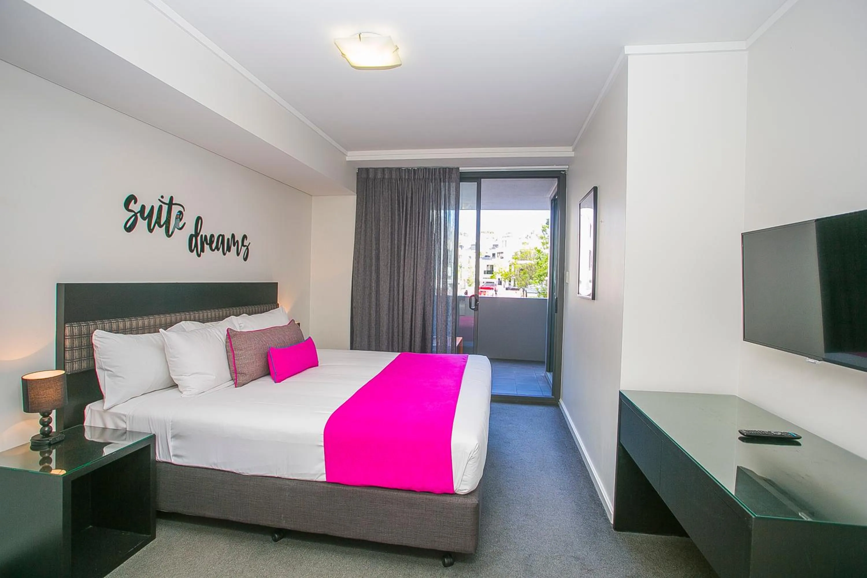 Bed in East Perth Suites Hotel