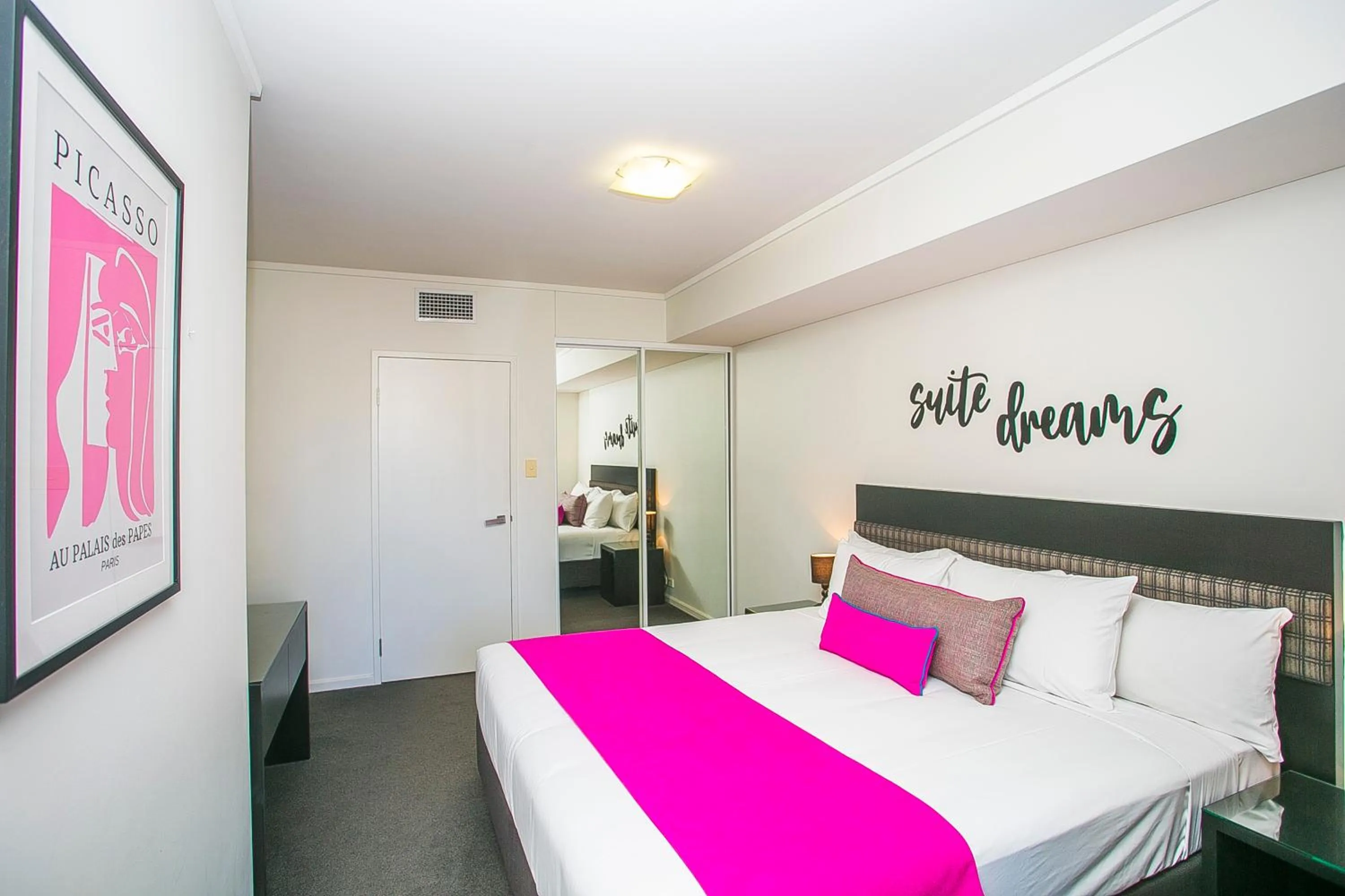 Bed in East Perth Suites Hotel