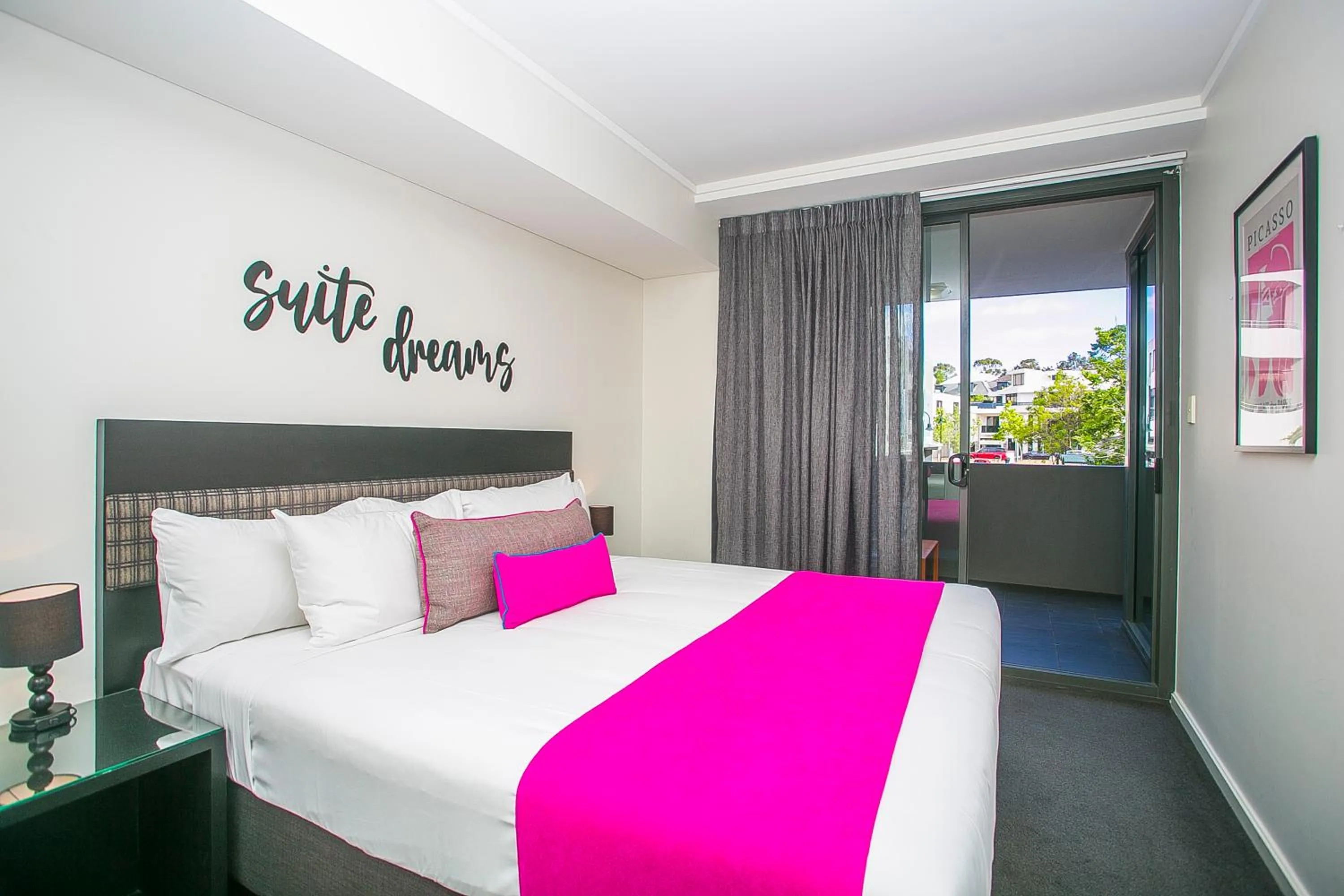 Bed in East Perth Suites Hotel