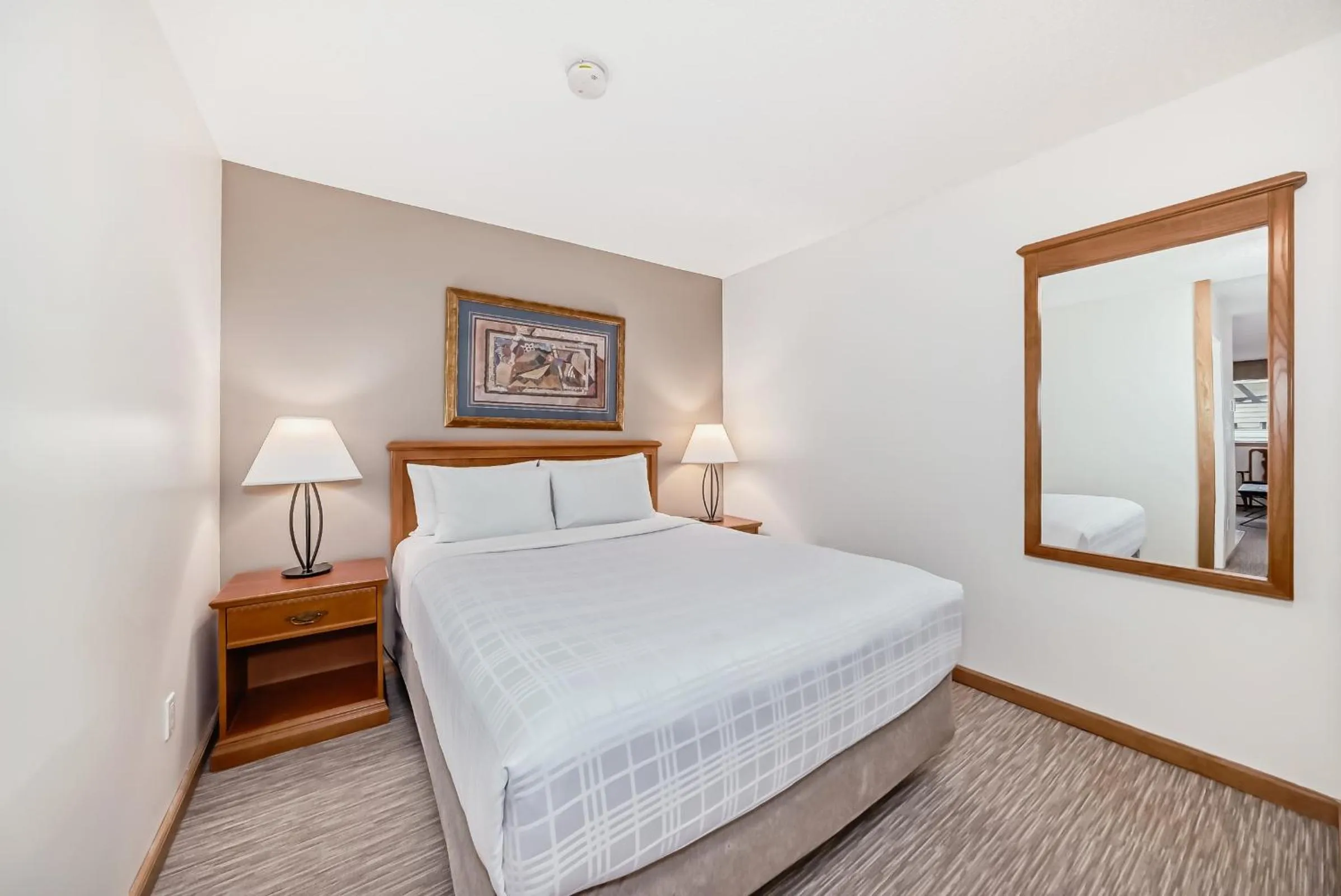 Bed in Jasper Inn & Suites by INNhotels