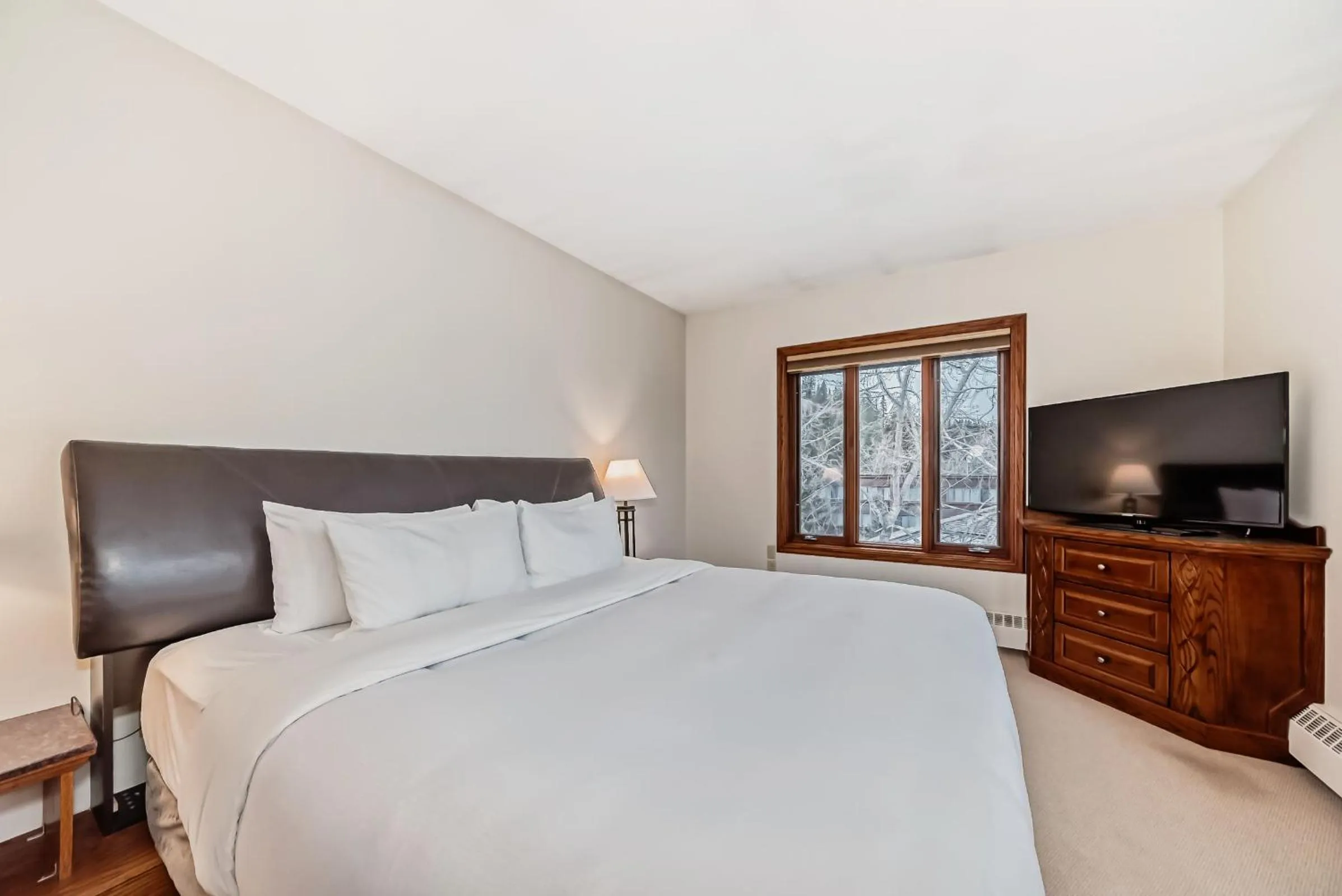 Bed in Jasper Inn & Suites by INNhotels