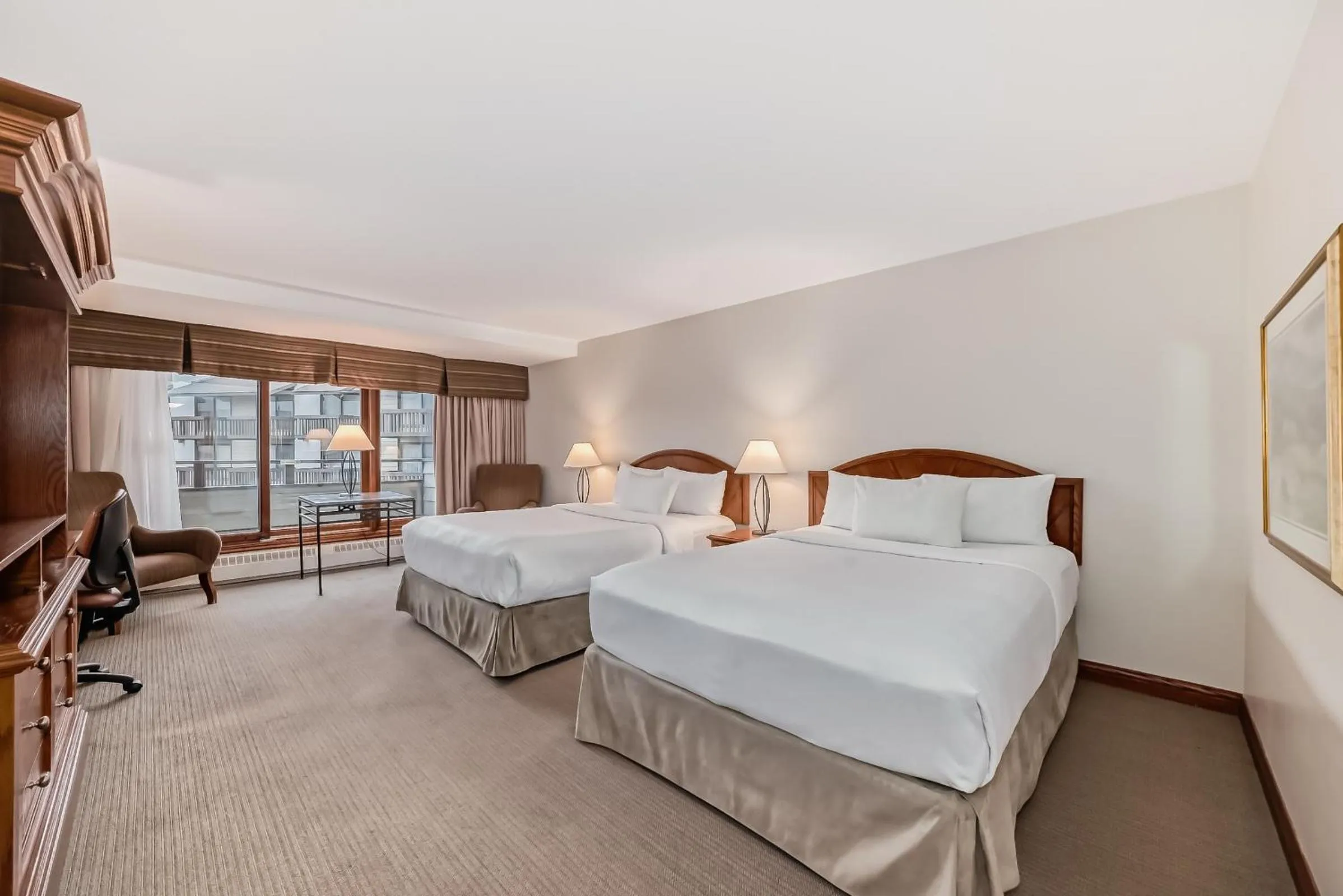 Bed in Jasper Inn & Suites by INNhotels