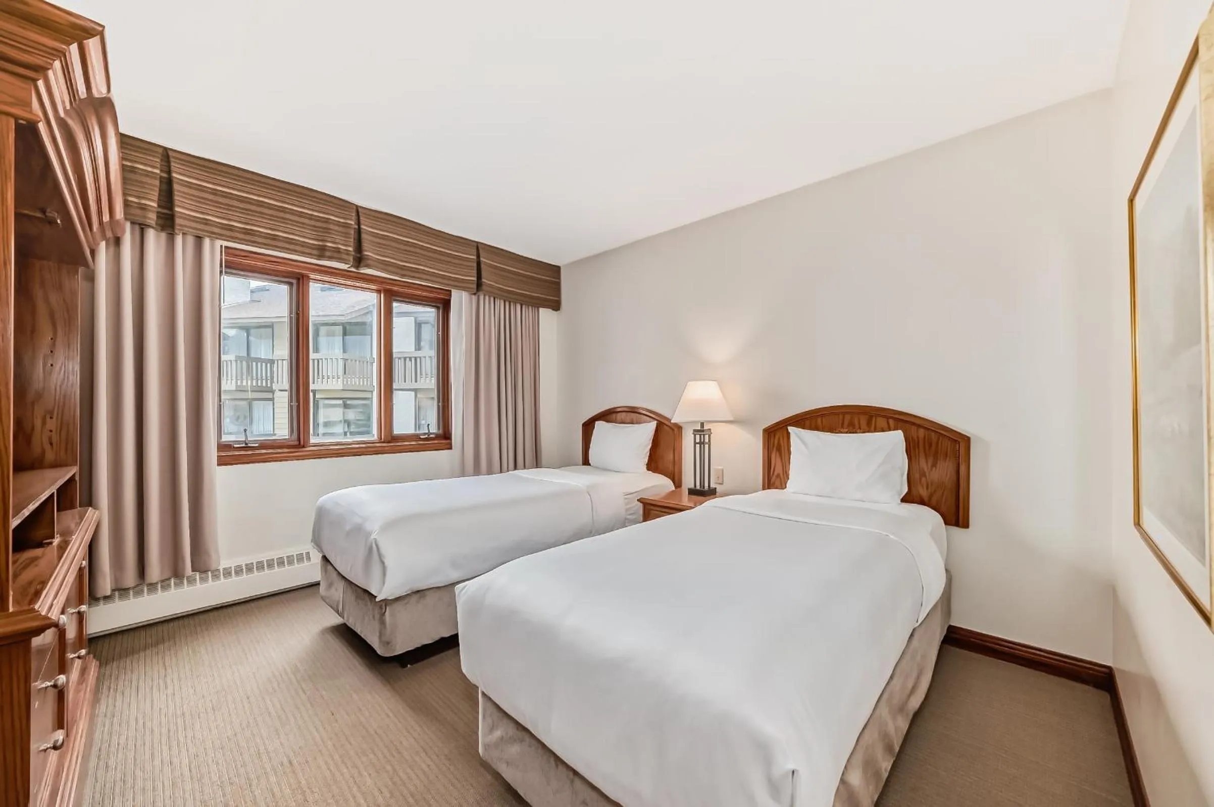 Bed in Jasper Inn & Suites by INNhotels