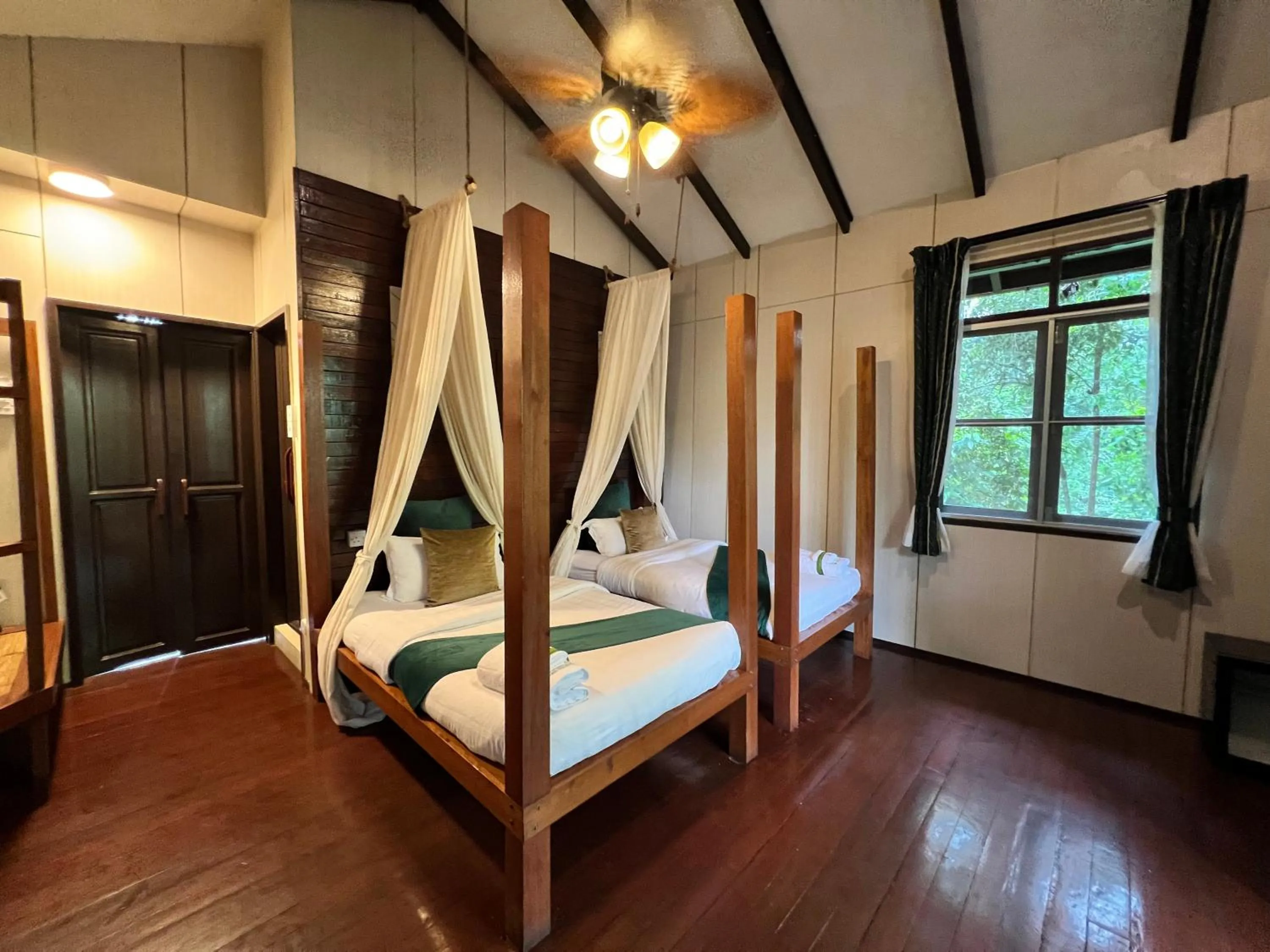 Bed in Sepilok Forest Edge Resort