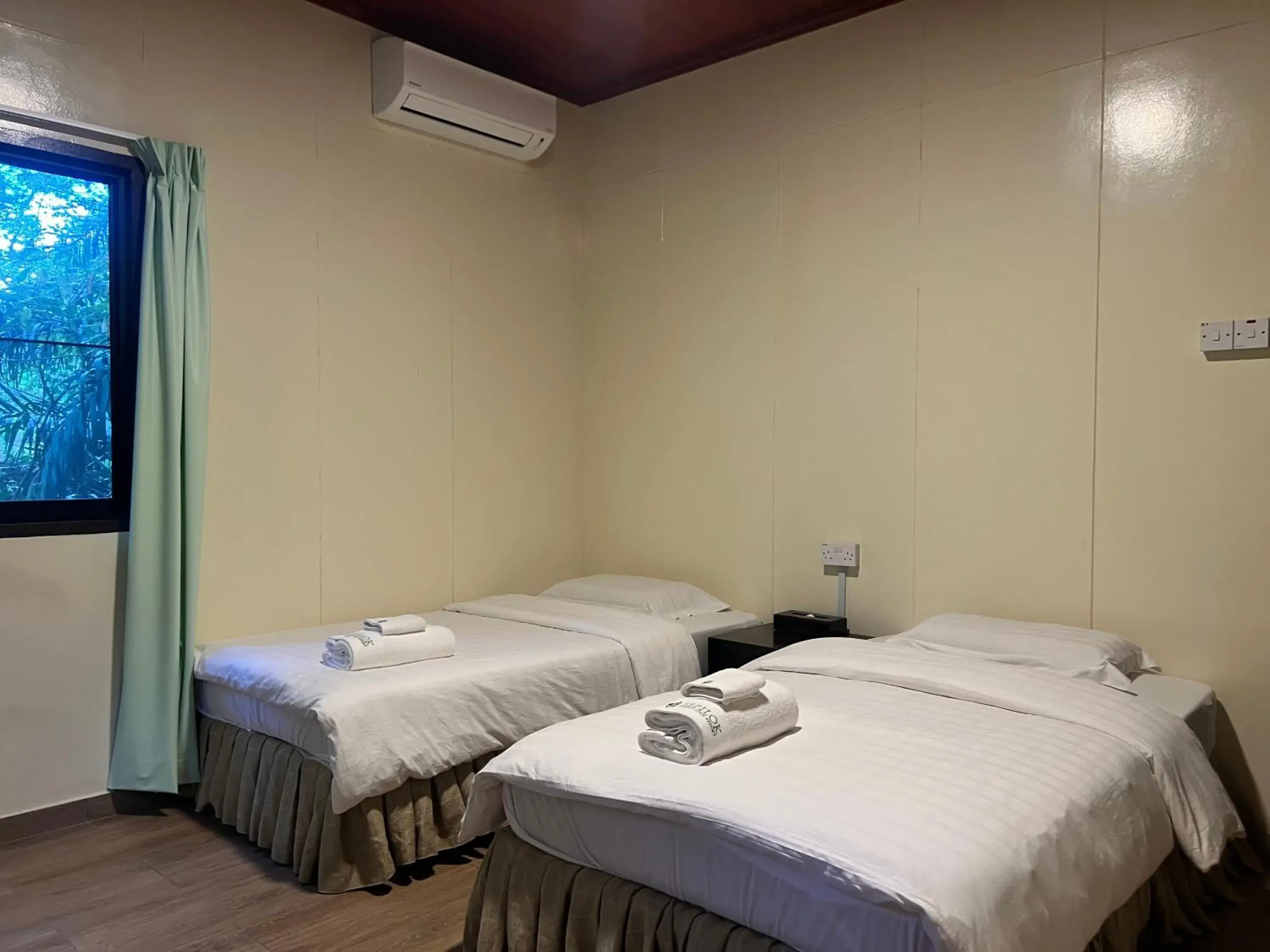 Bed in Sepilok Forest Edge Resort Bed in Sepilok Forest Edge Resort