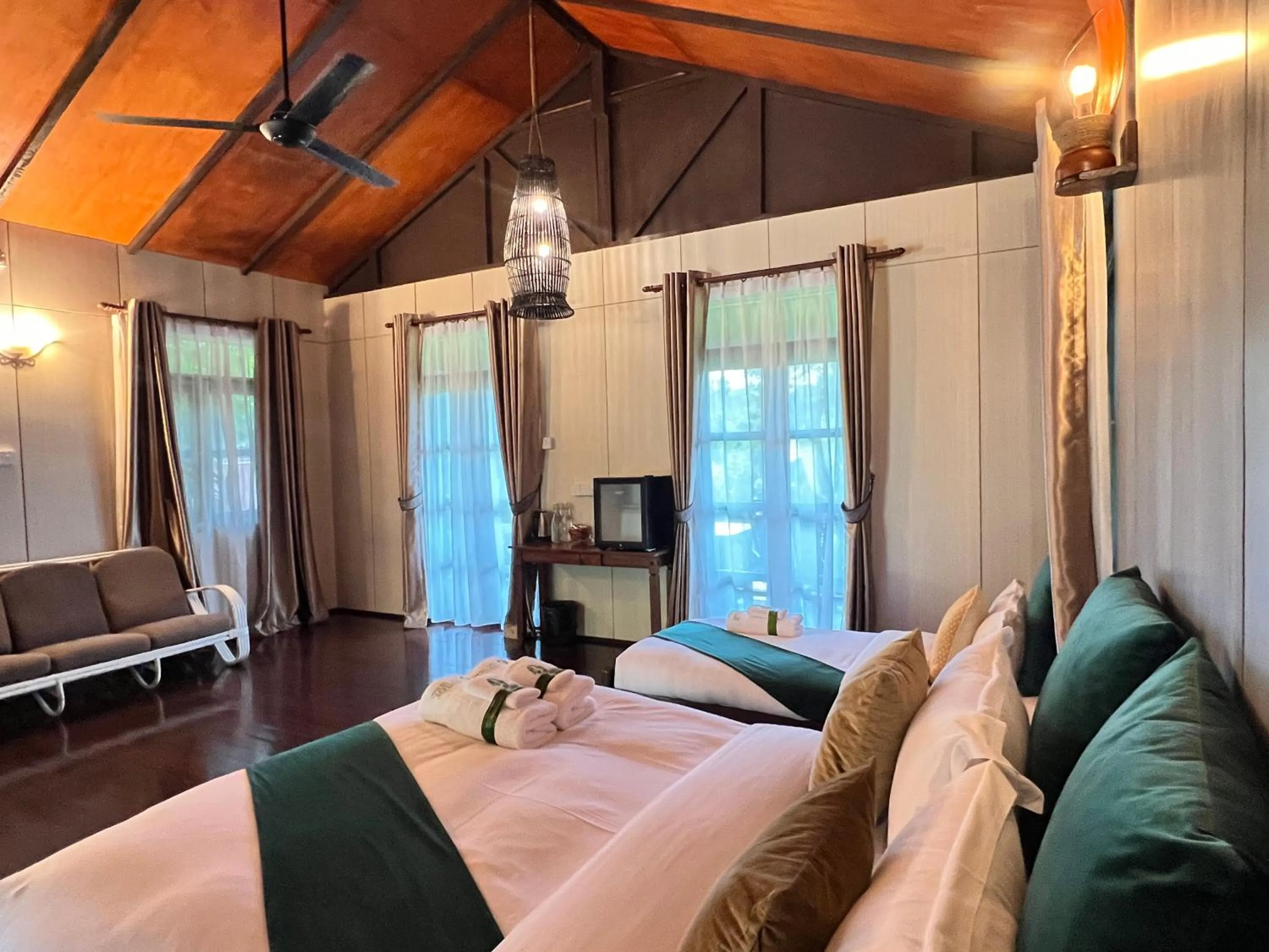 Bed in Sepilok Forest Edge Resort