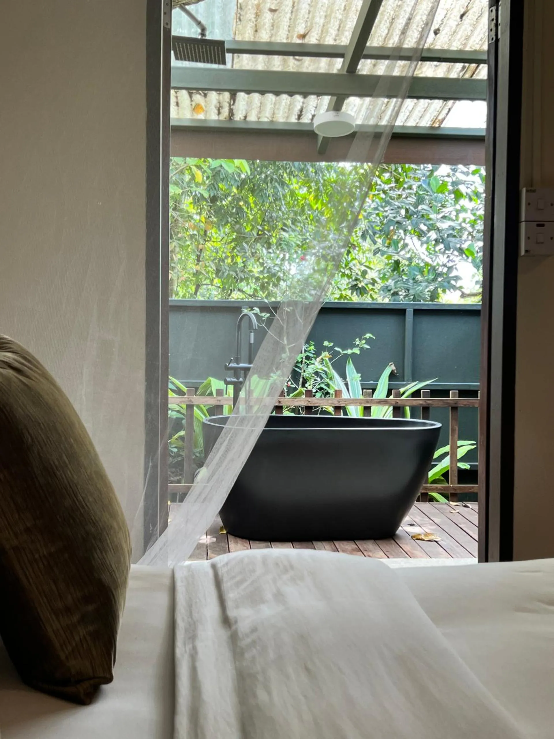 Bed in Sepilok Forest Edge Resort