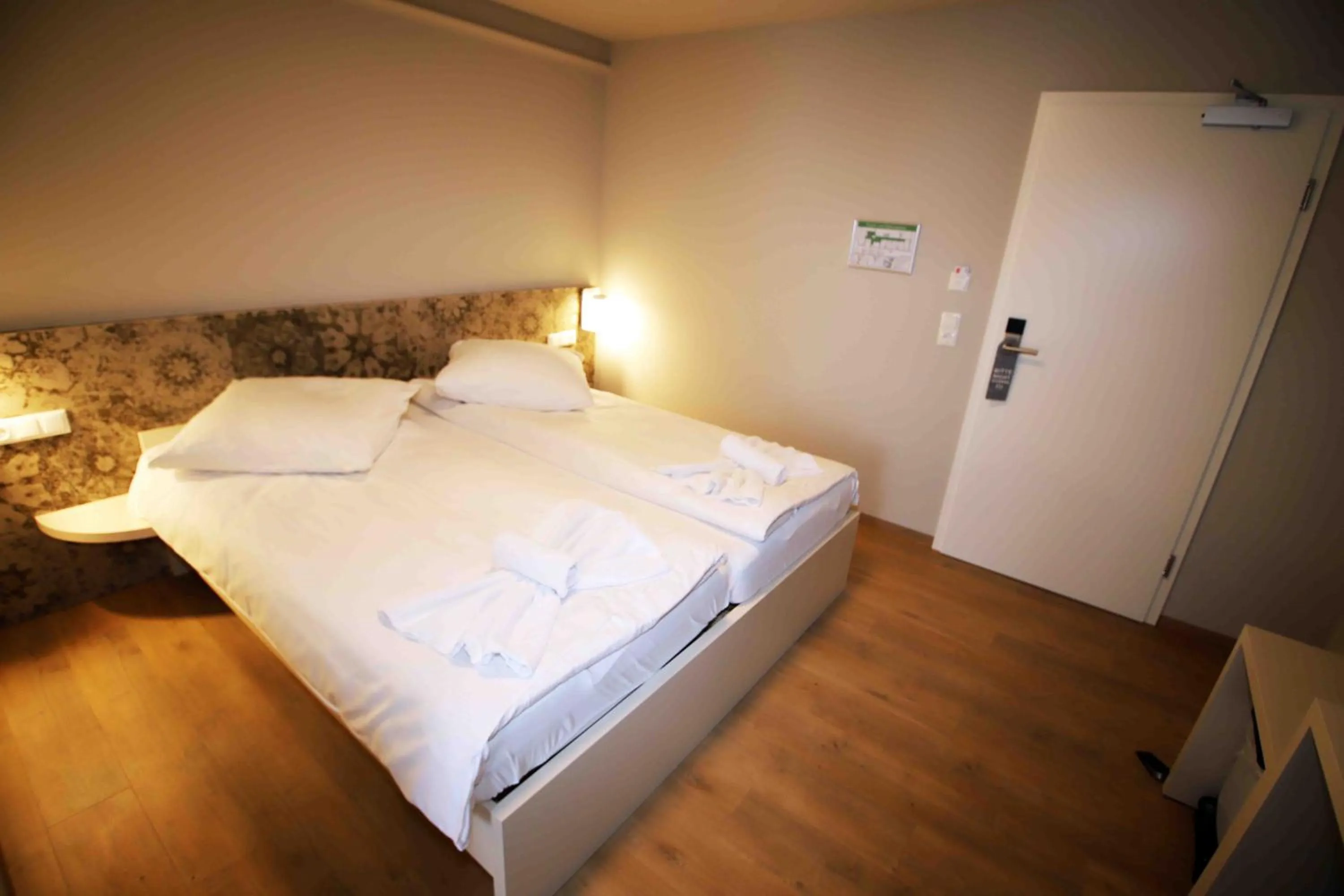 Bed in Pension Villa Colosseo im Herzen von Meiningen