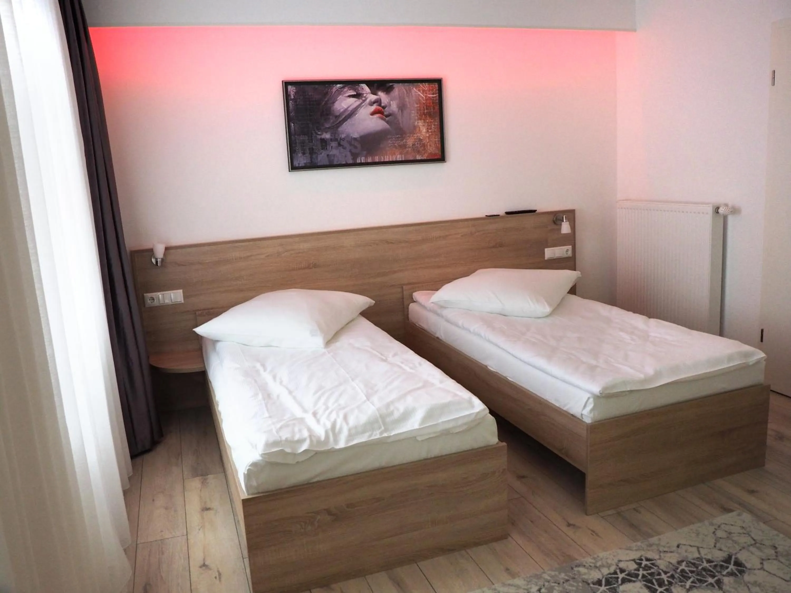 Bed in Pension Villa Colosseo im Herzen von Meiningen