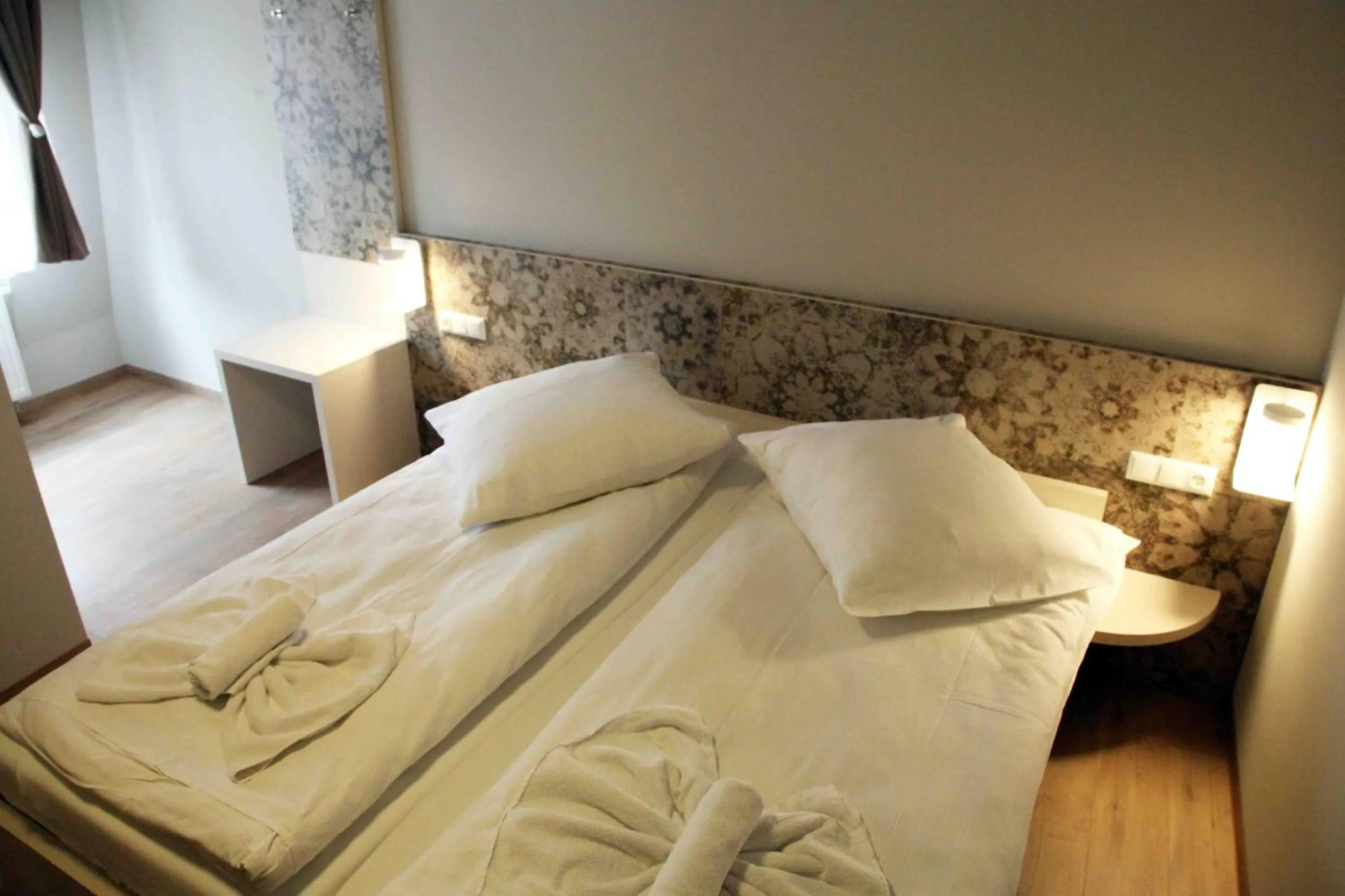 Bed in Pension Villa Colosseo im Herzen von Meiningen