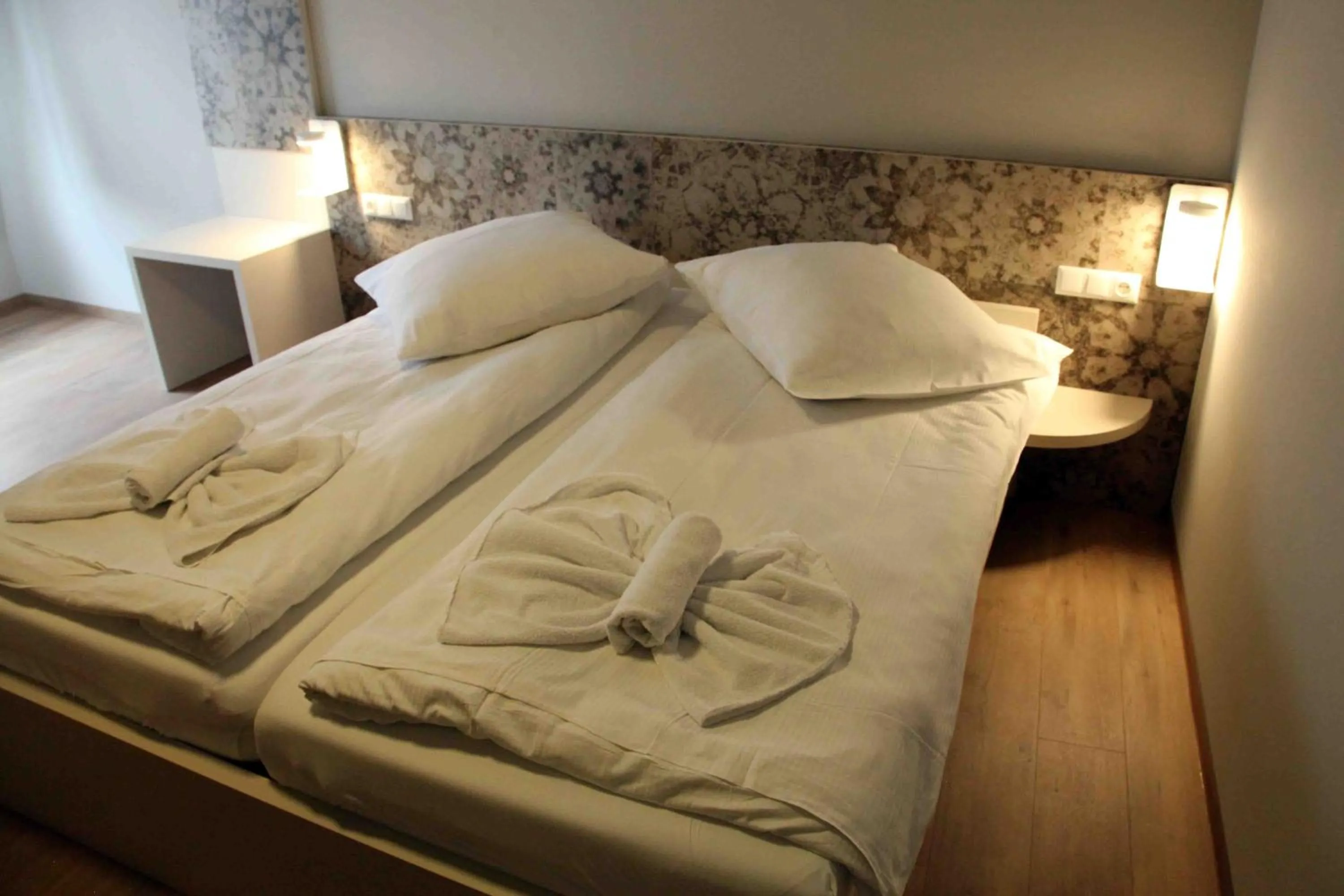 Bed in Pension Villa Colosseo im Herzen von Meiningen