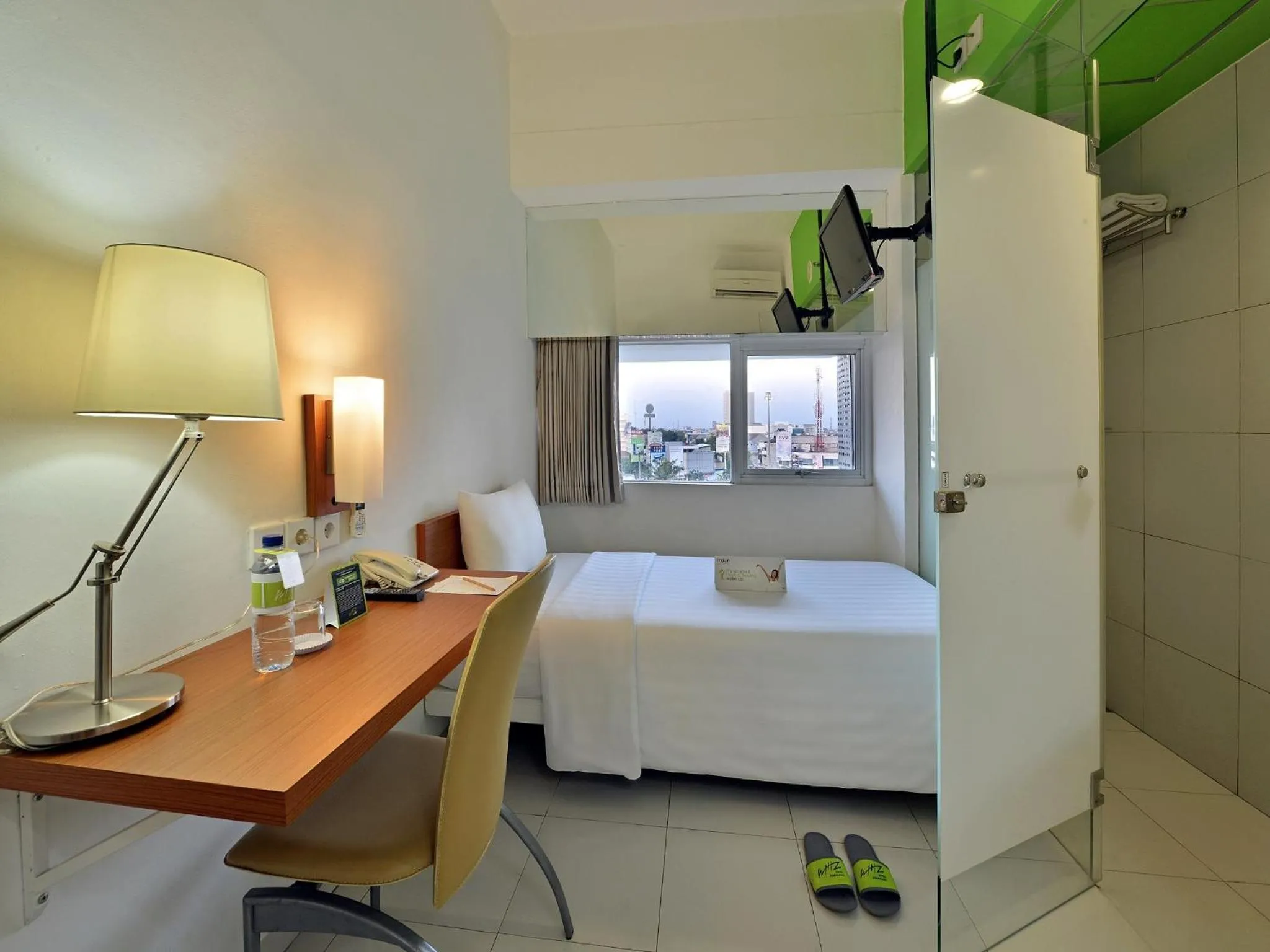 Photo of the whole room, Bed in Whiz Hotel Pemuda Semarang