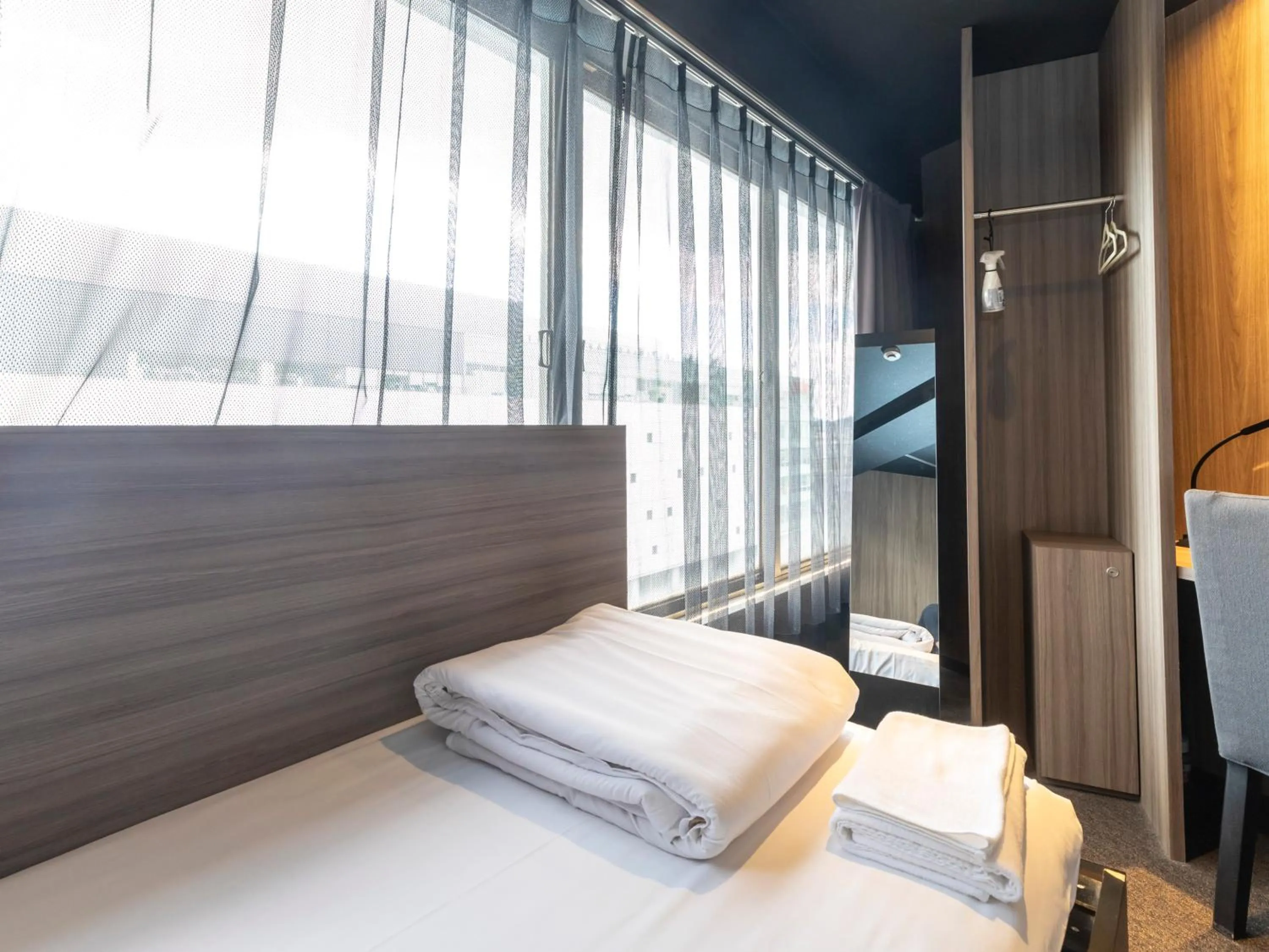 Bed in Tabist CapsuleHotel APODS Himeji Station