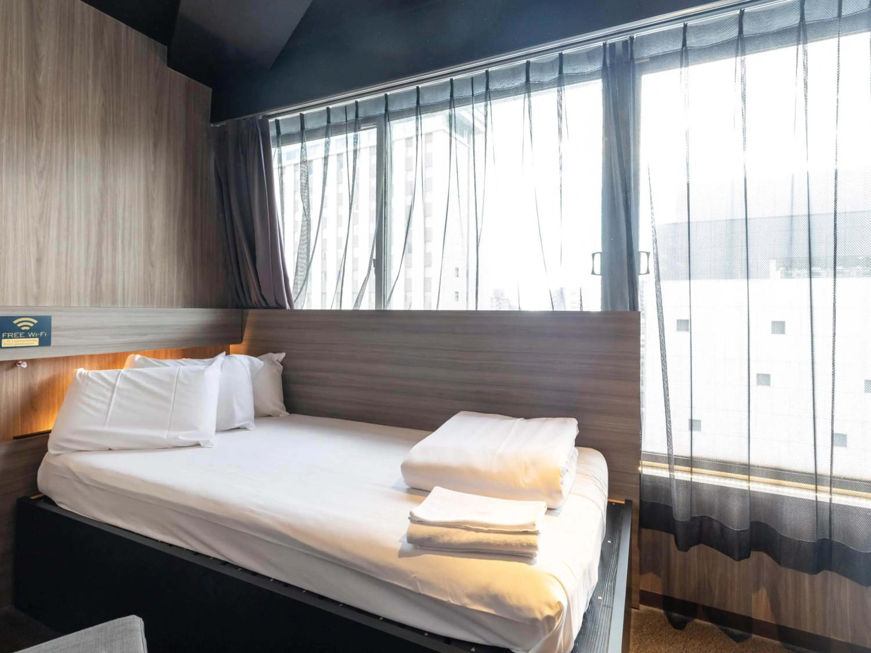 Bed in Tabist CapsuleHotel APODS Himeji Station