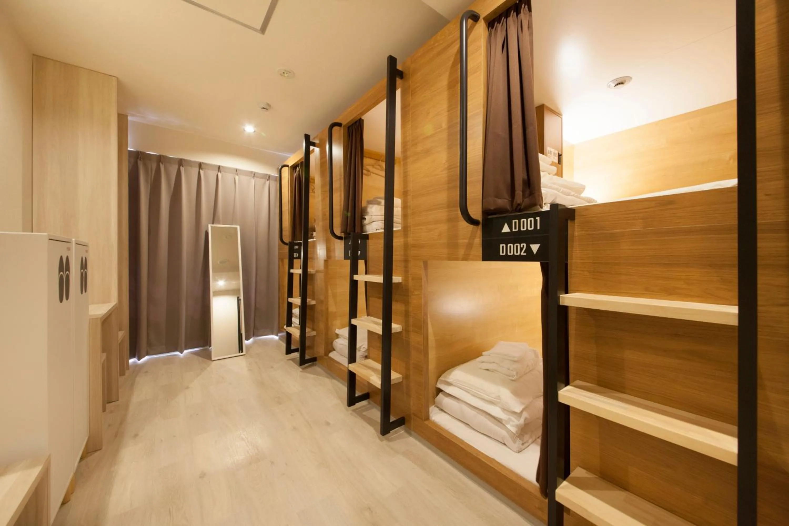 Bed in Tabist CapsuleHotel APODS Himeji Station