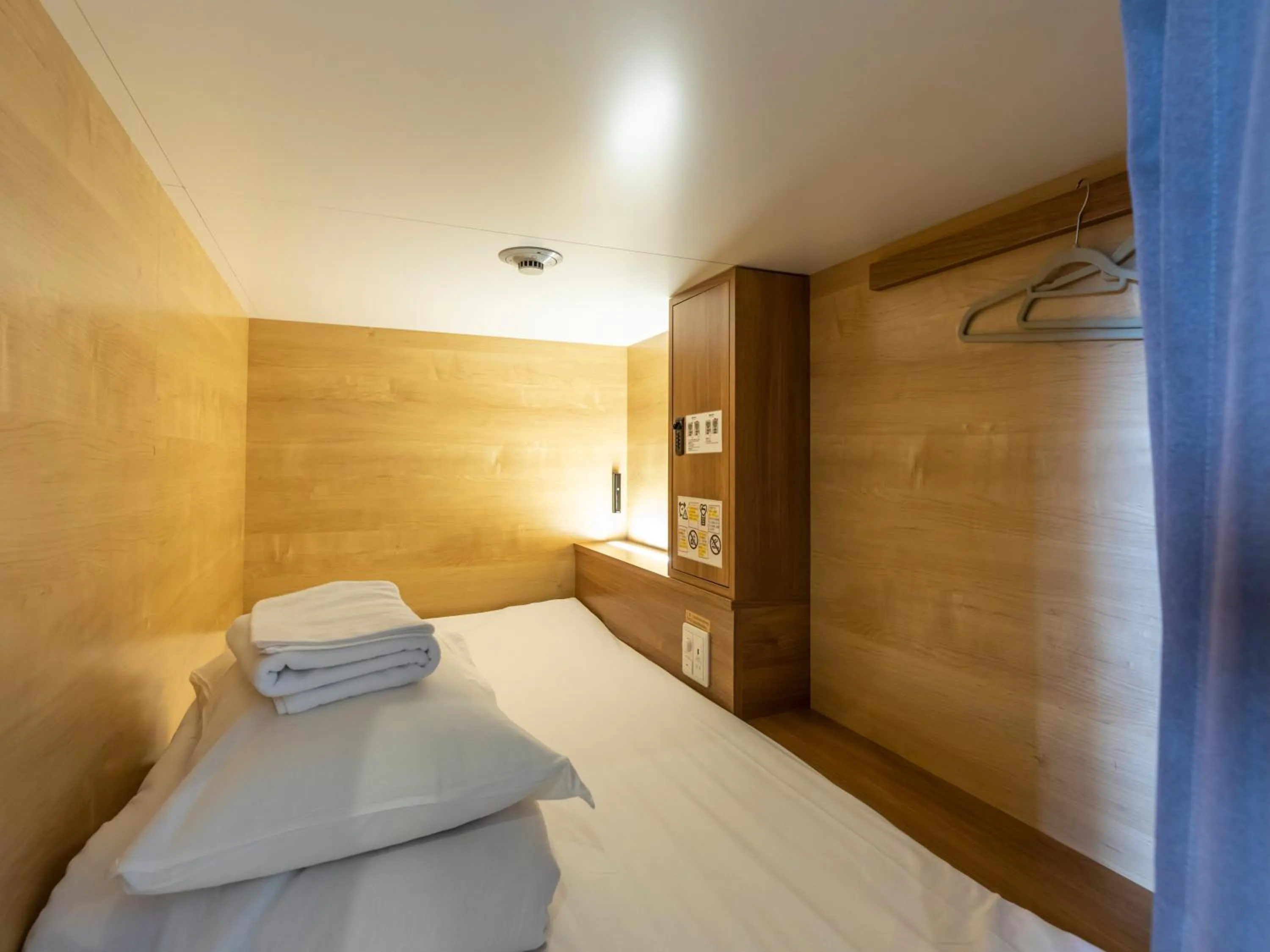 Bed in Tabist CapsuleHotel APODS Himeji Station