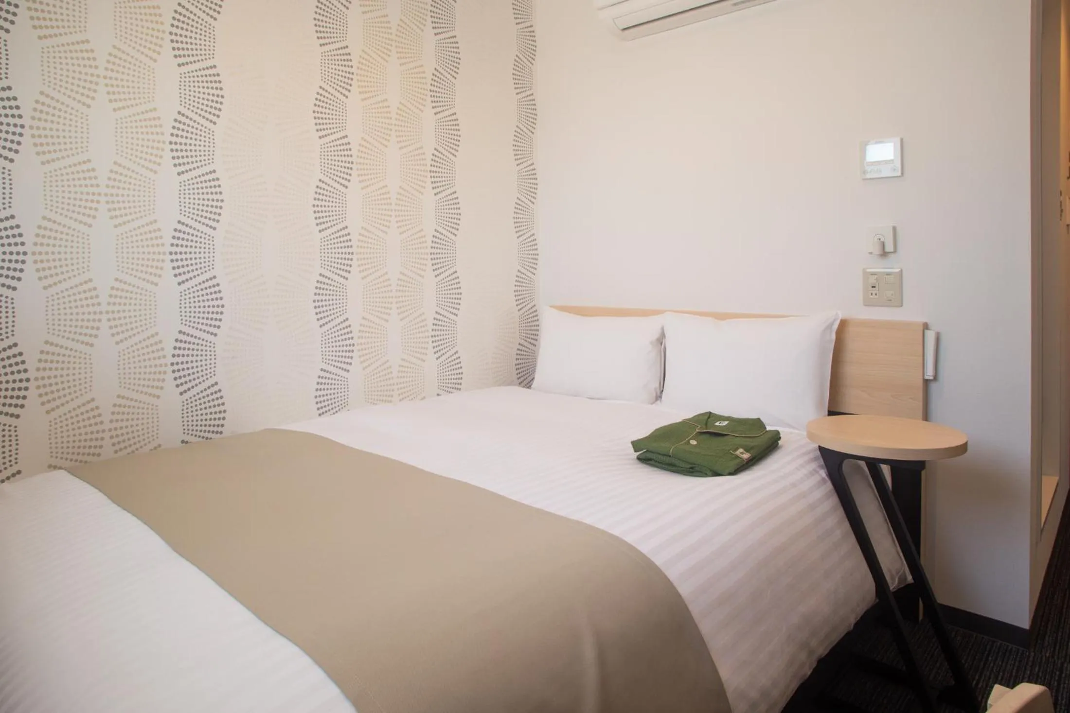 Bed in Hotel Kuretakeso Hiroshima Otemachi