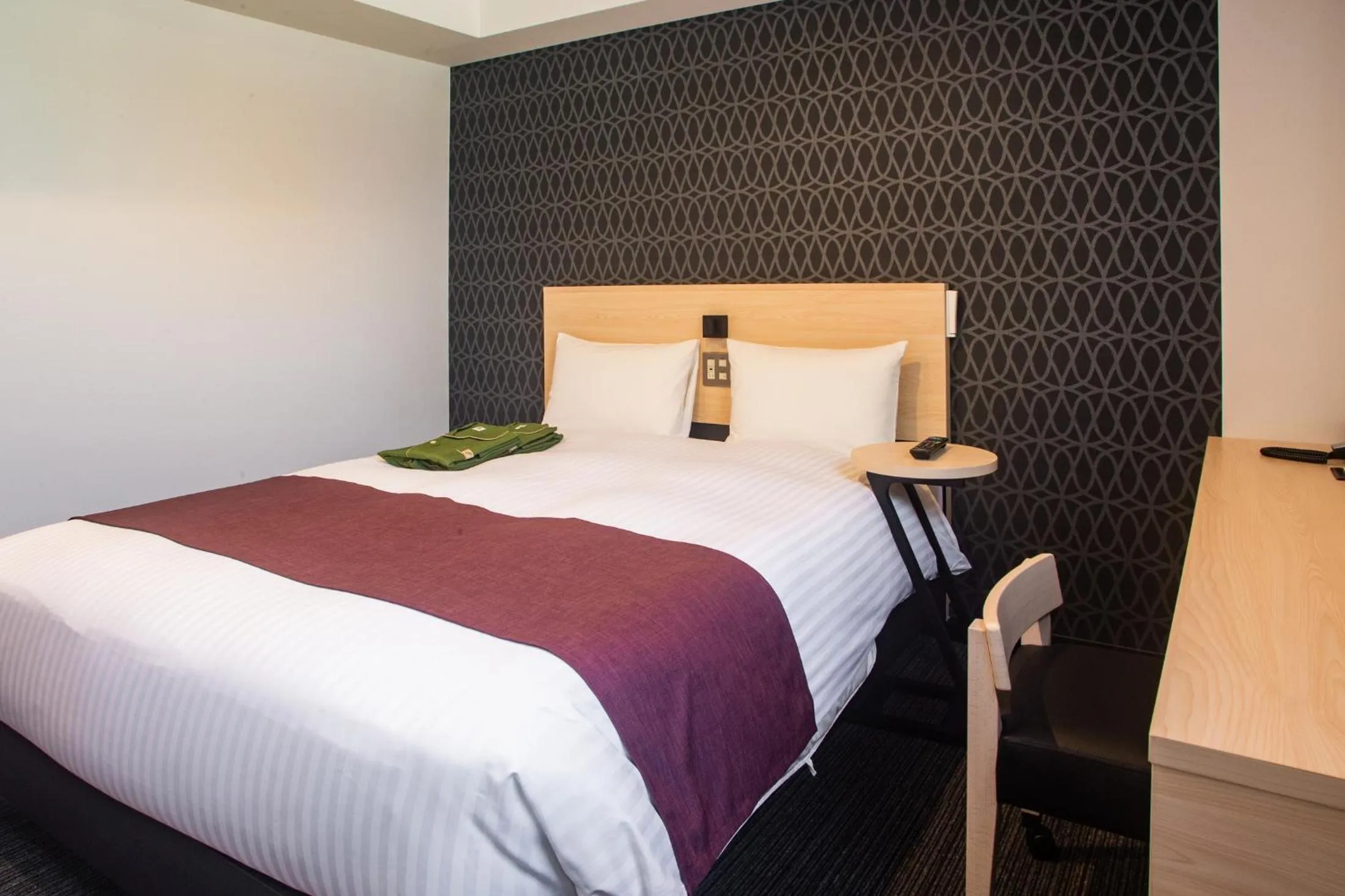 Bed in Hotel Kuretakeso Hiroshima Otemachi