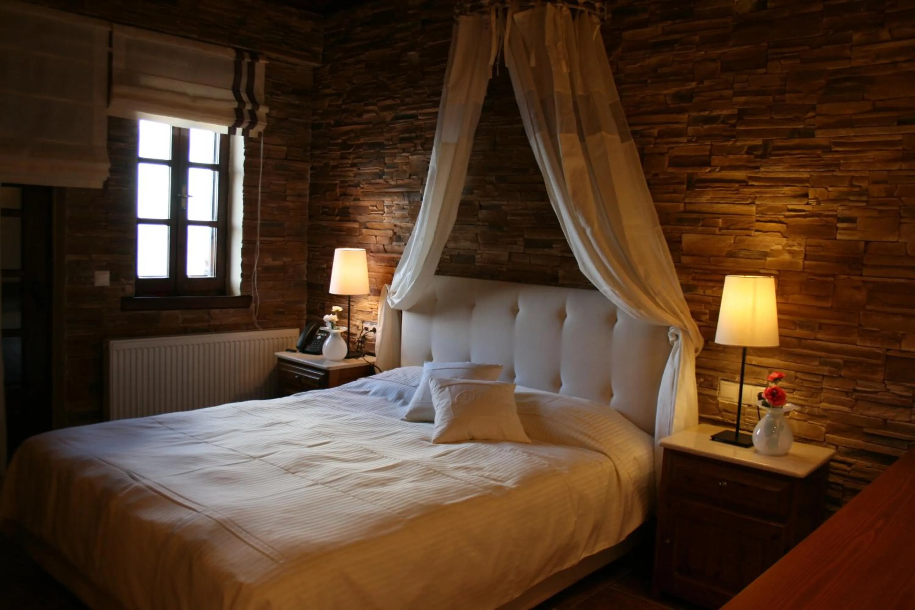 Bed in Boutique Hotel Kentrikon & Bungalows