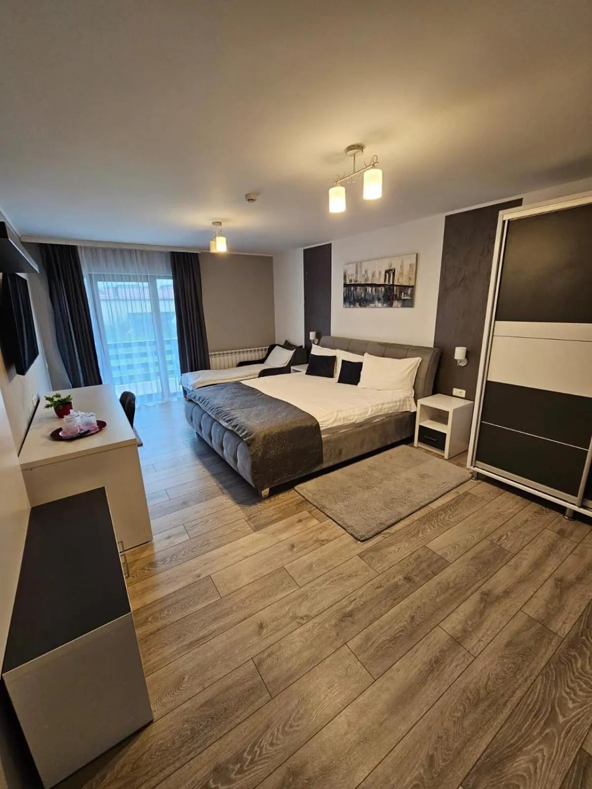 Communal lounge/ TV room, Bed in Pensiunea Andrei Moieciu