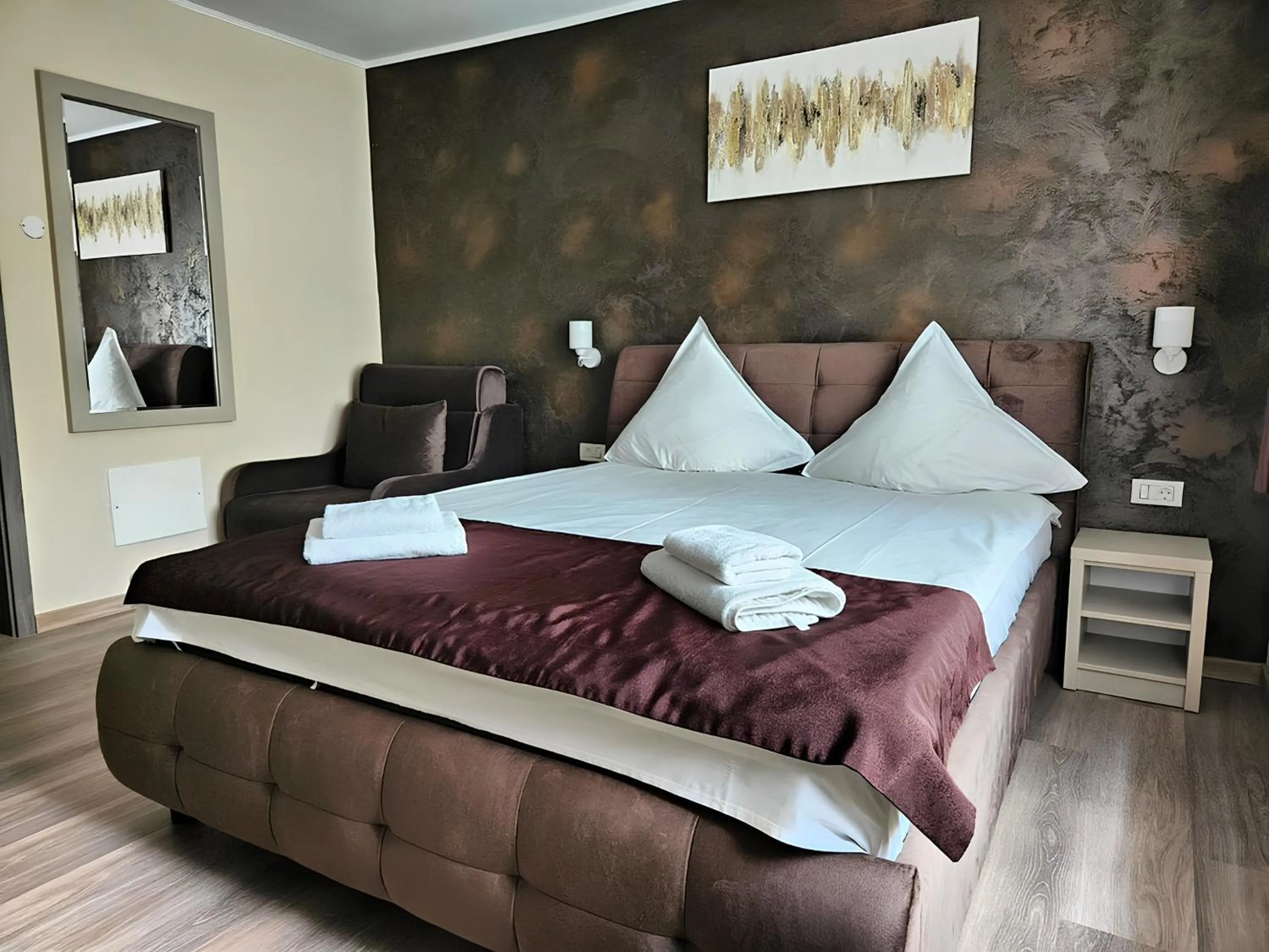 Bed in Pensiunea Andrei Moieciu