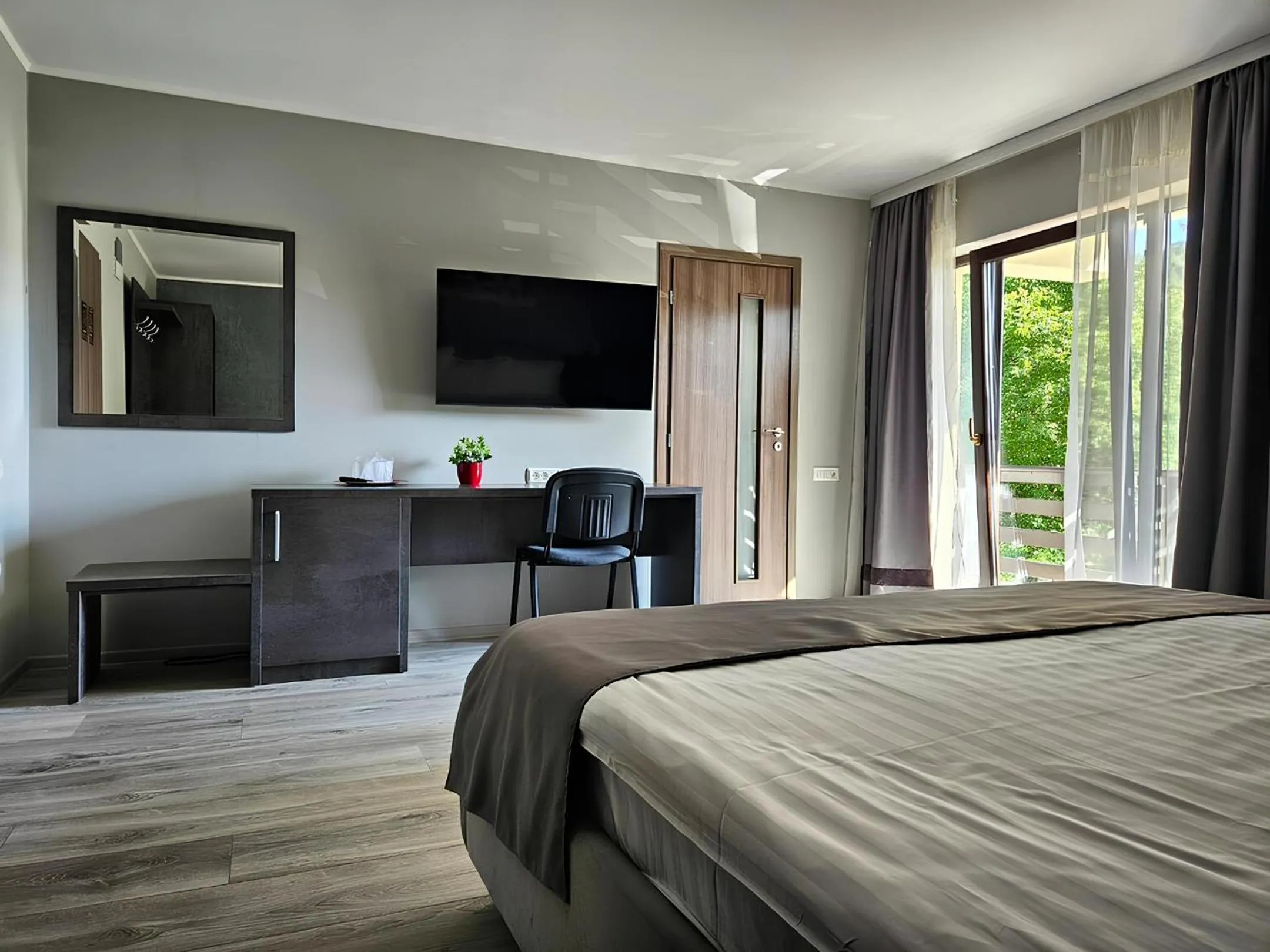 Communal lounge/ TV room, Bed in Pensiunea Andrei Moieciu