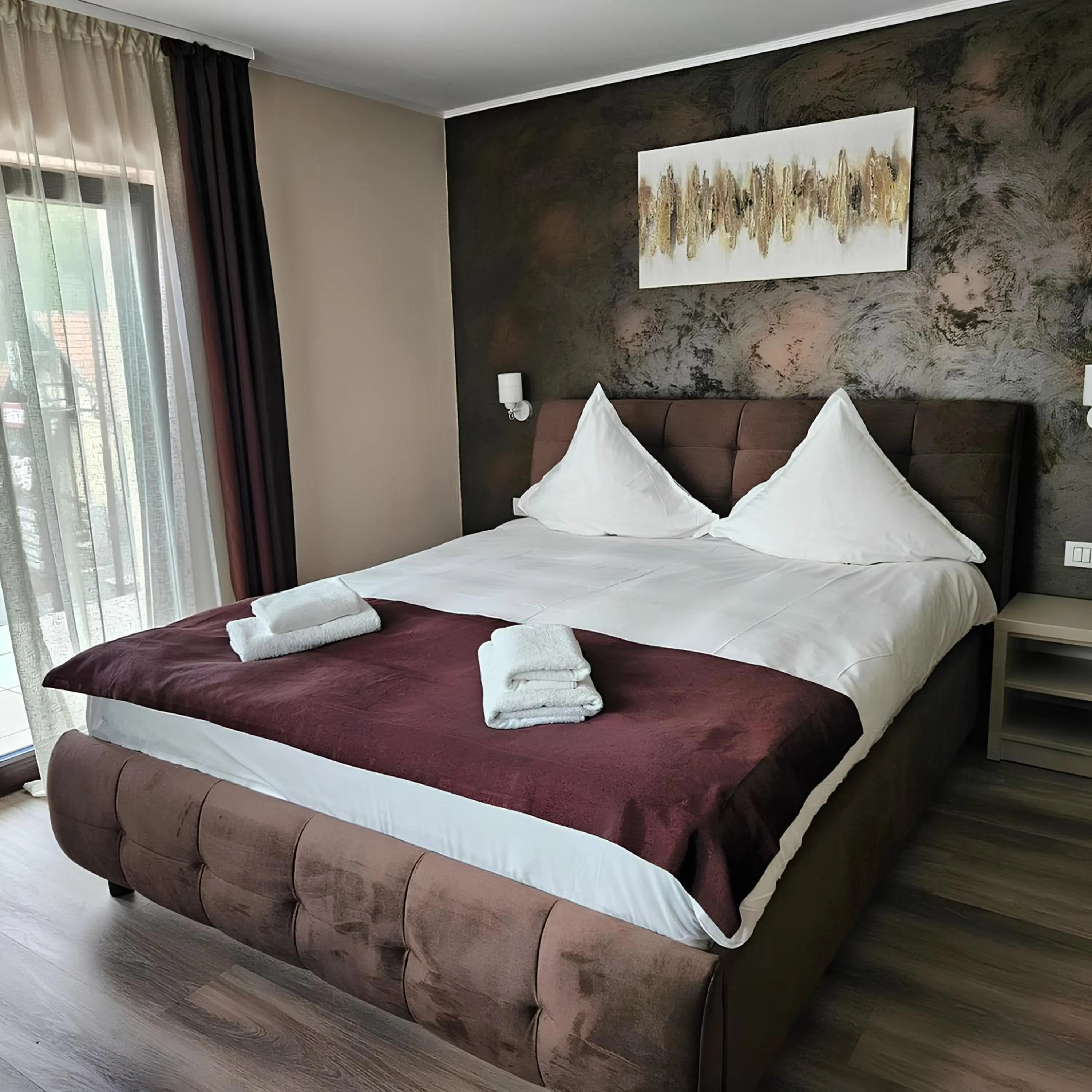 Bed in Pensiunea Andrei Moieciu