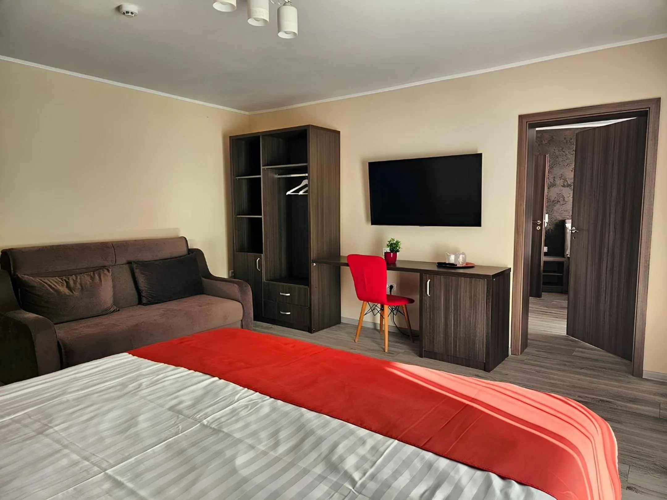Communal lounge/ TV room, Bed in Pensiunea Andrei Moieciu
