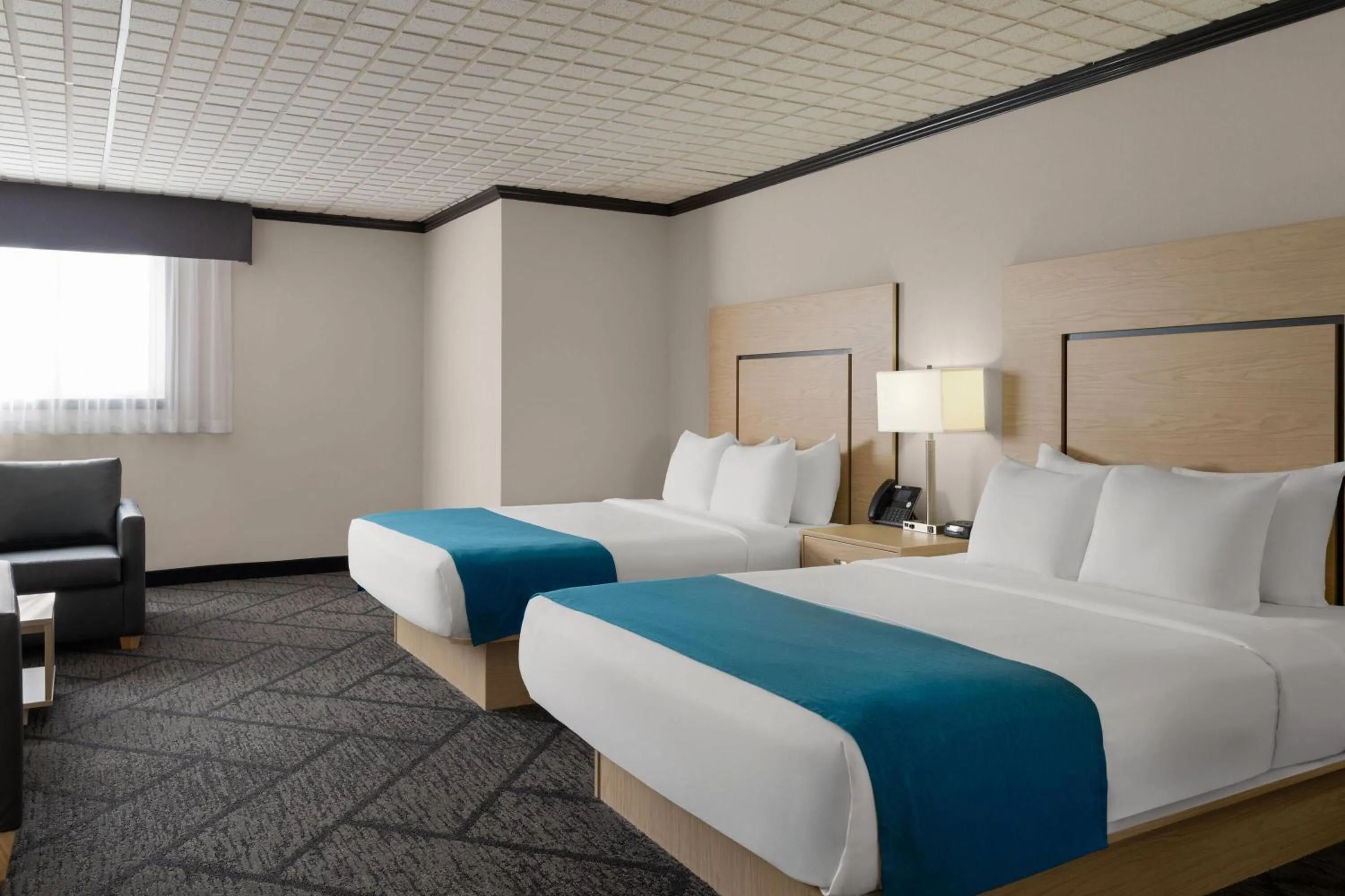 Photo of the whole room, Bed in Sternwheeler Hotel & Conference Centre, Trademark by Wyndham