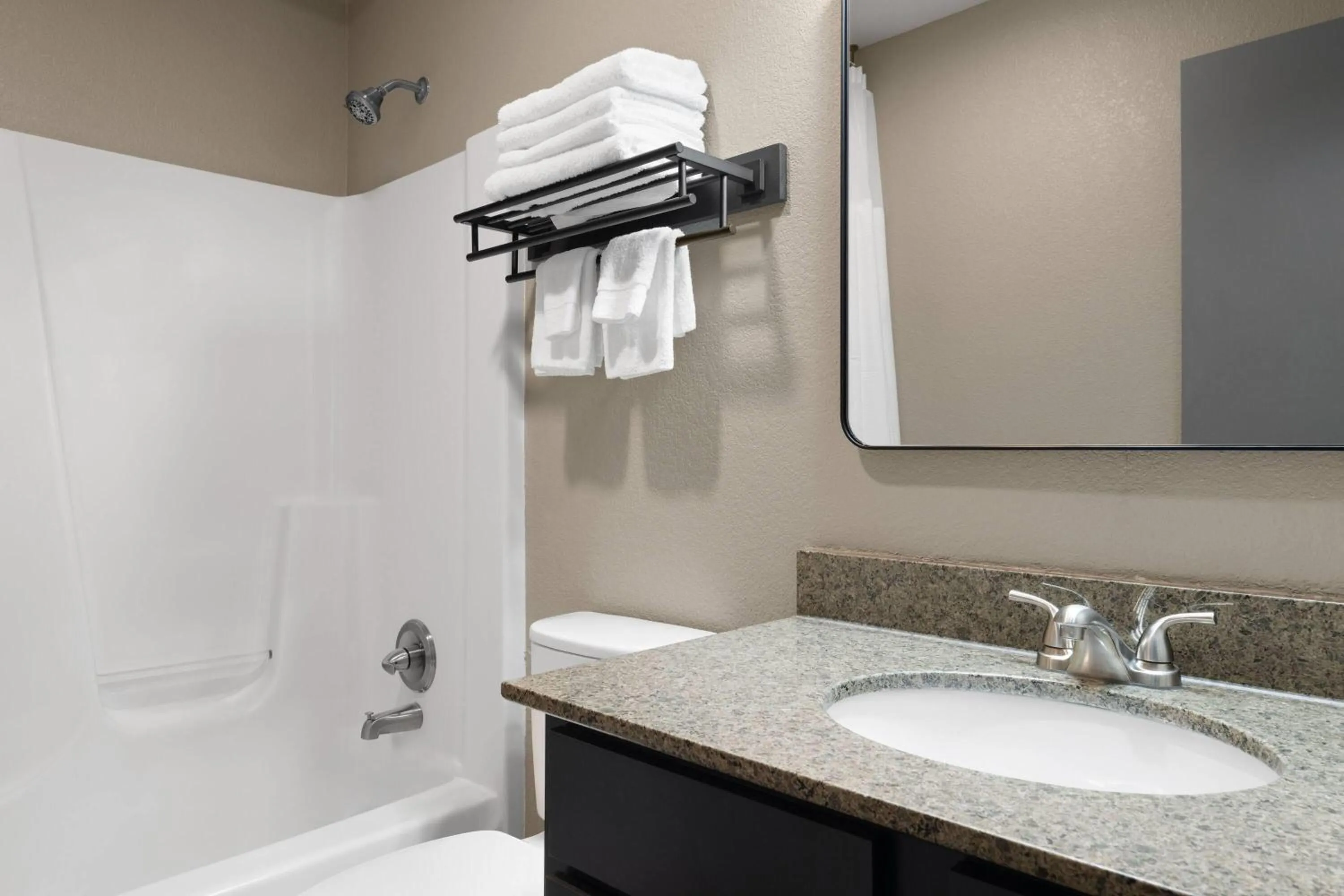 Bathroom in Eastland Suites Hotel & Conference Ctr, Trademark by Wyndham