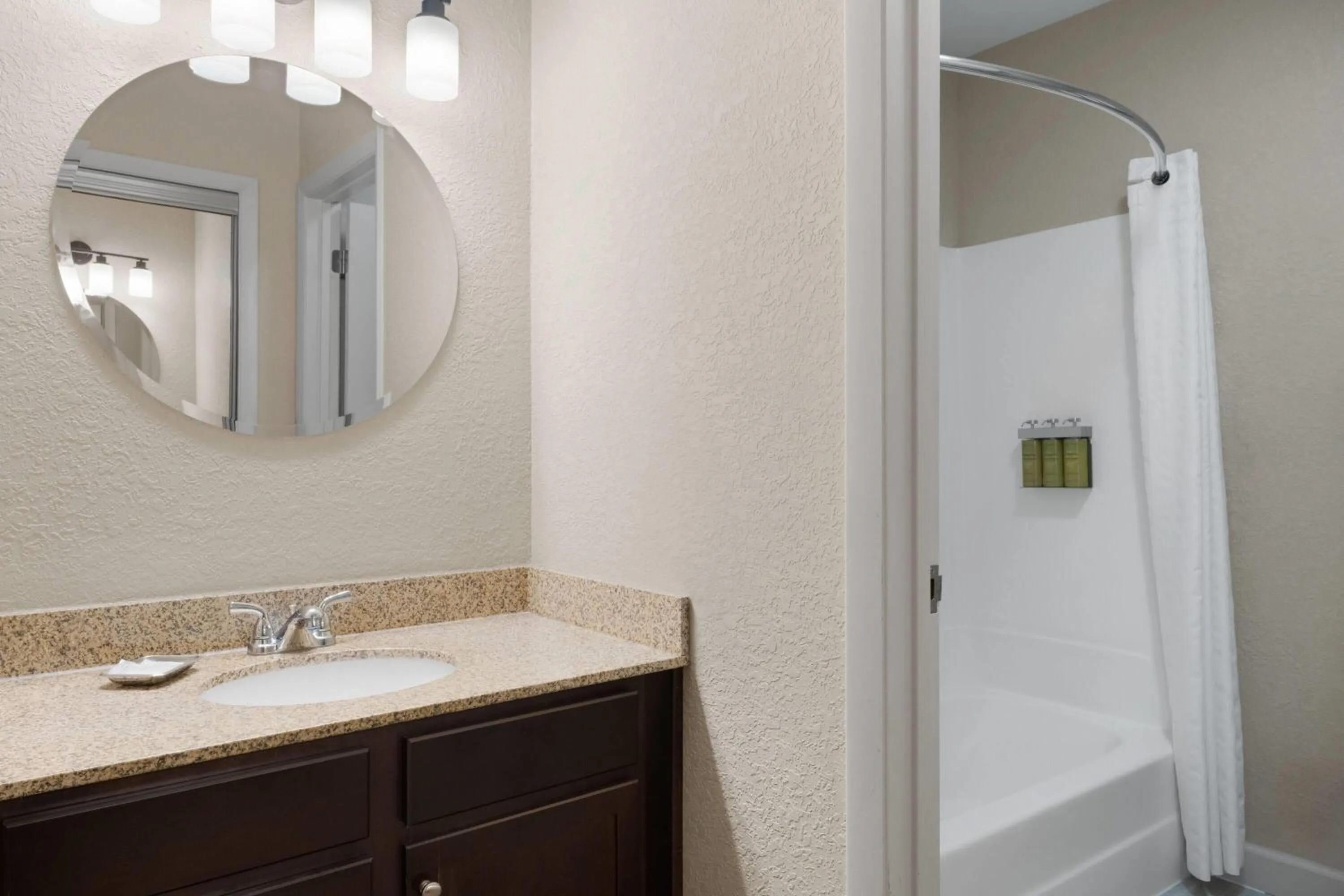 Bathroom in Eastland Suites Hotel & Conference Ctr, Trademark by Wyndham