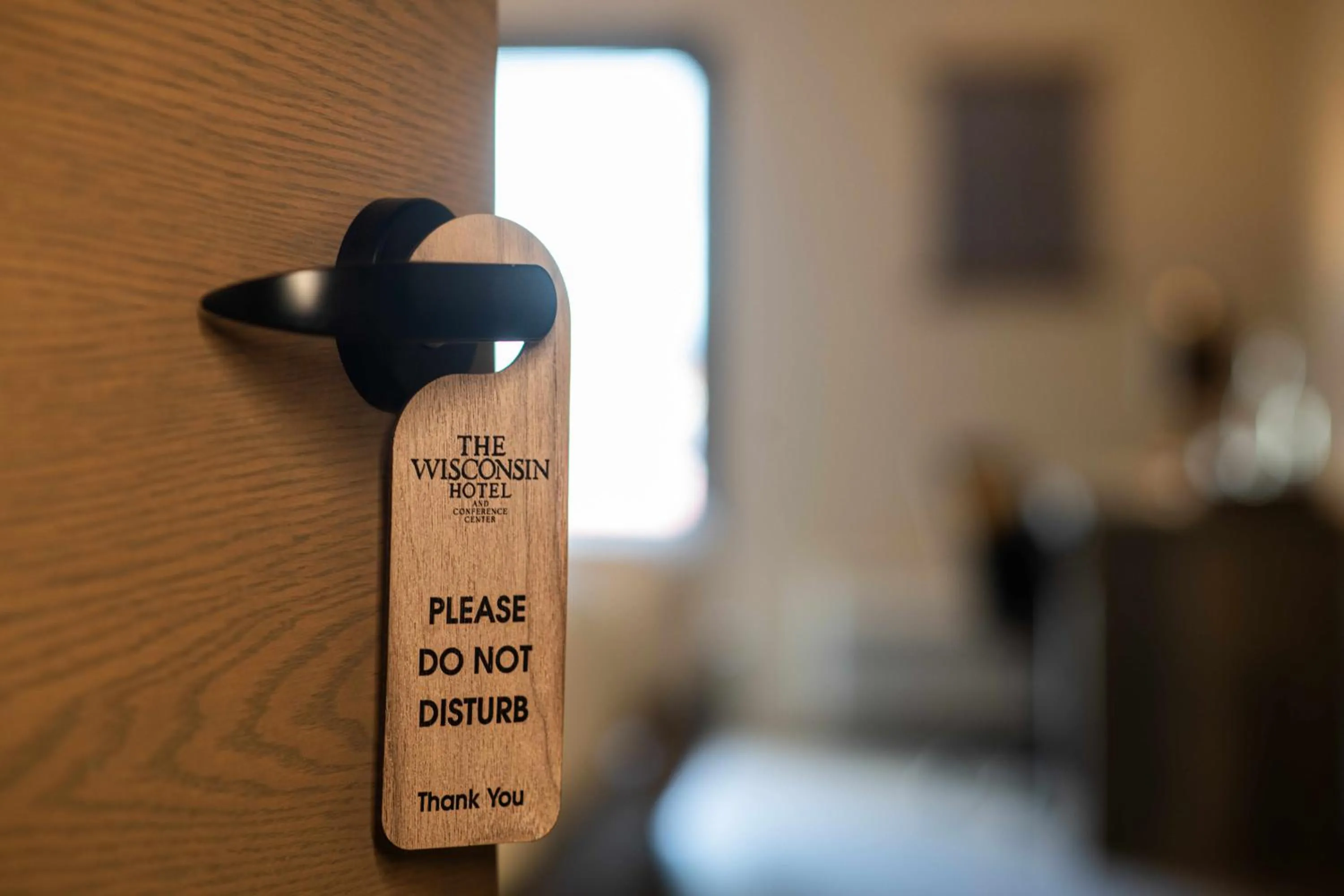 Text overlay, Bed in The Wisconsin Hotel & Conference Center