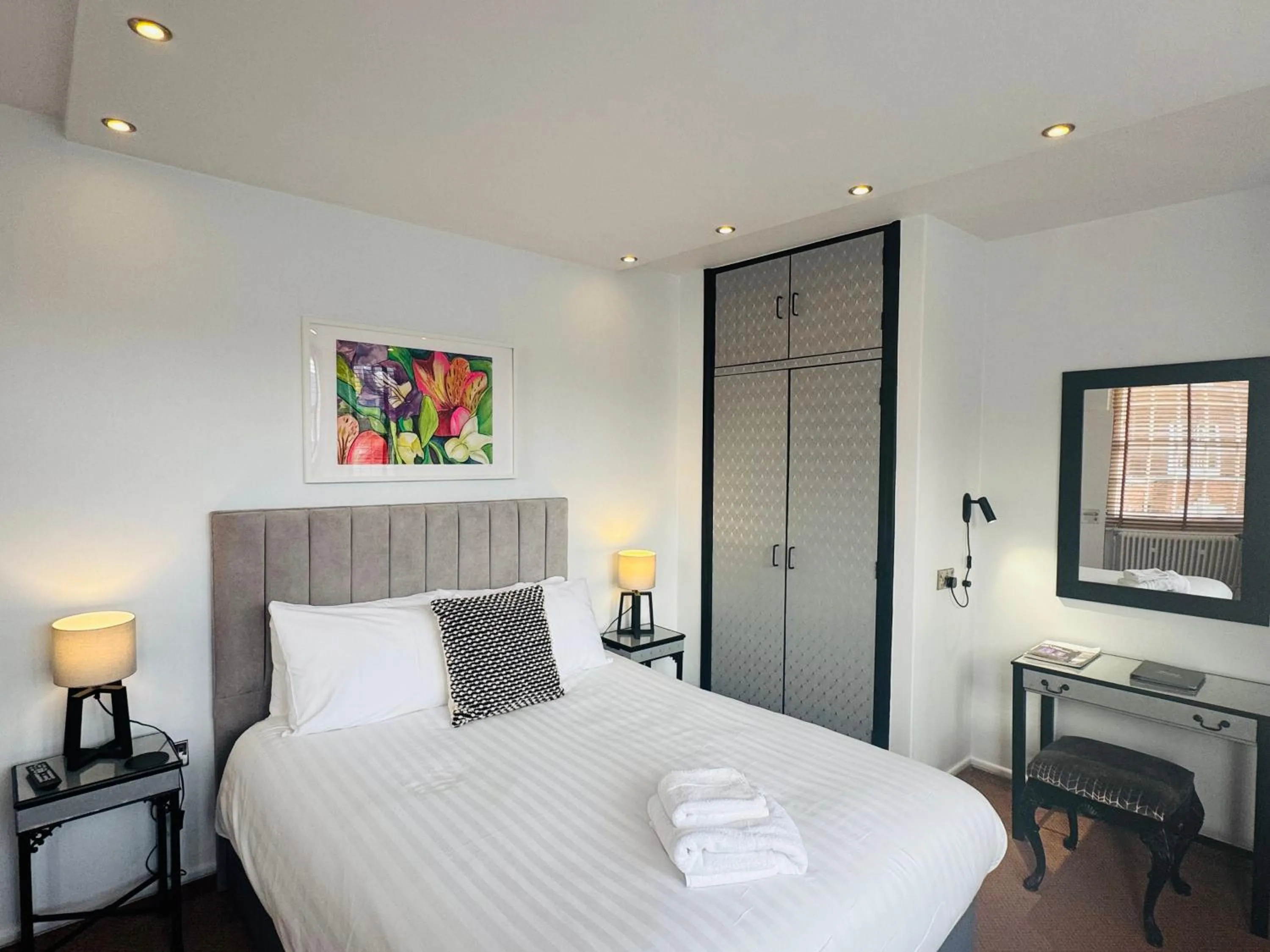 Bed in Charlotte House Hotel