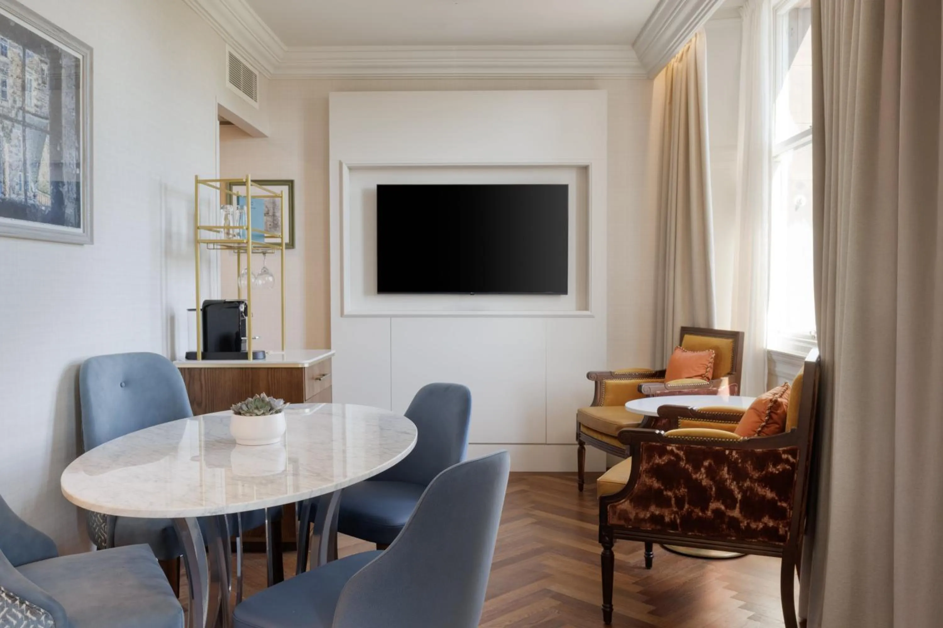 Living room in The Caledonian Edinburgh, Curio Collection by Hilton