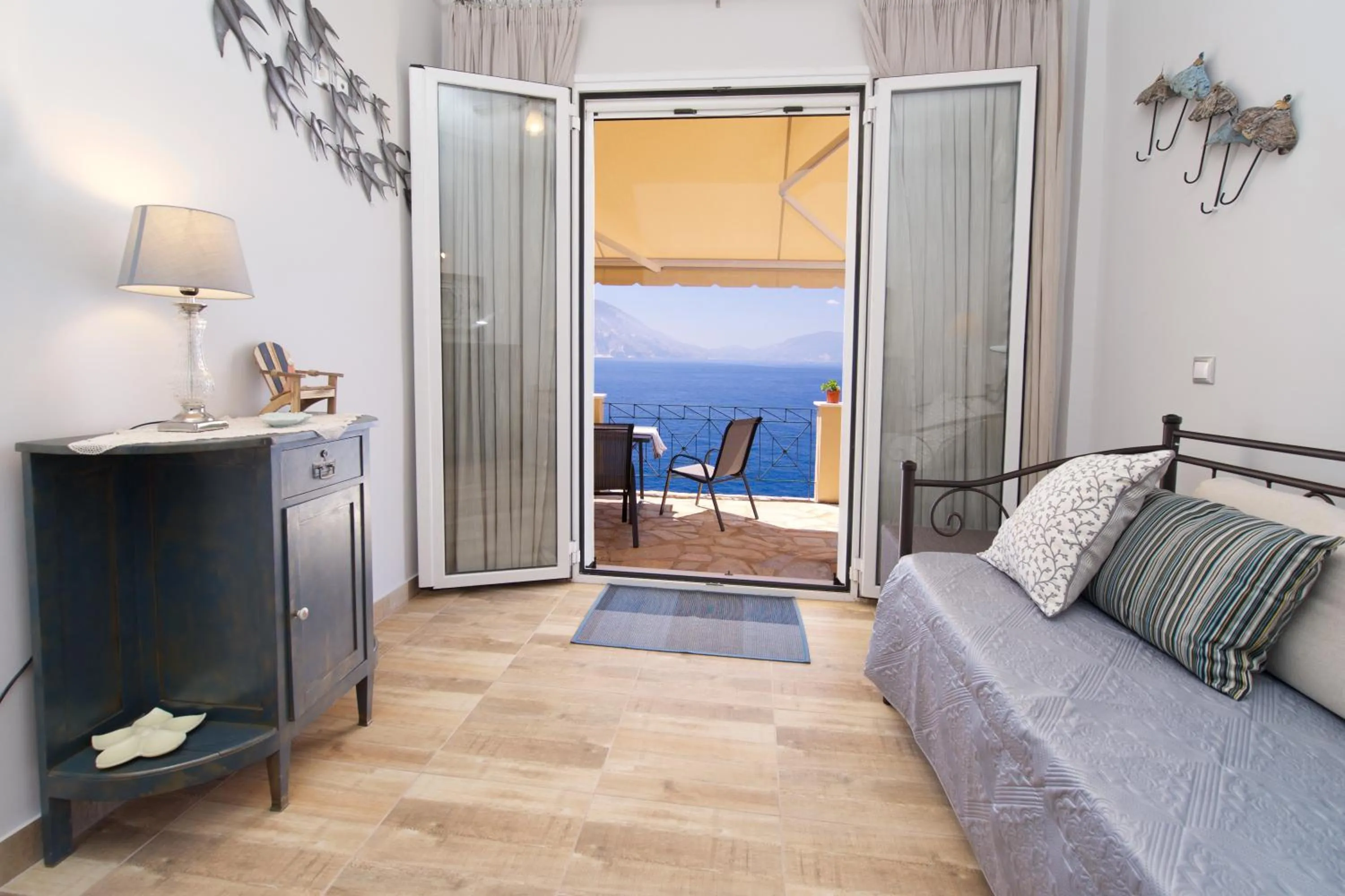 Communal lounge/ TV room in Villa Apoplous with pool