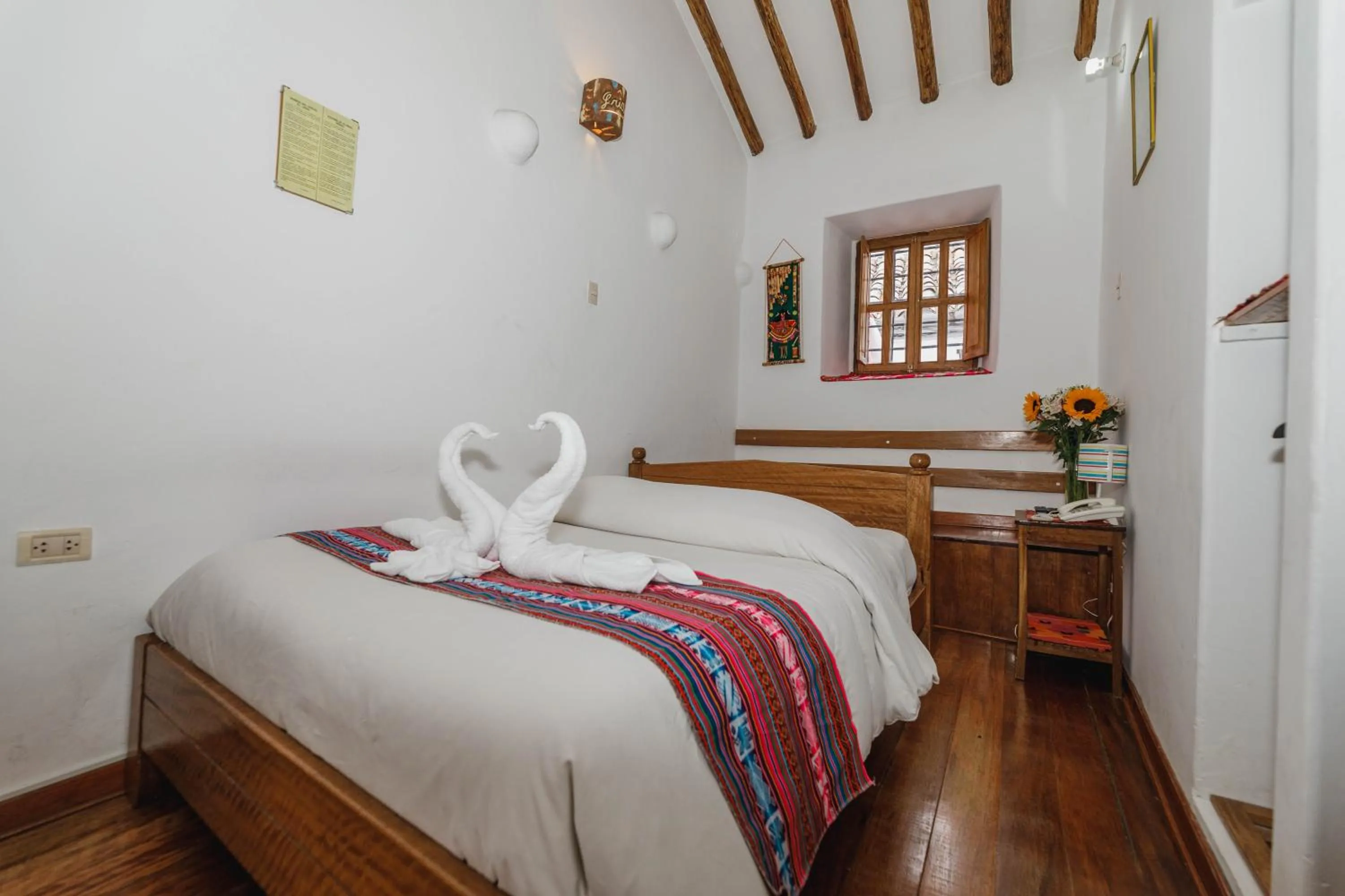 Bed in Hostal El Grial