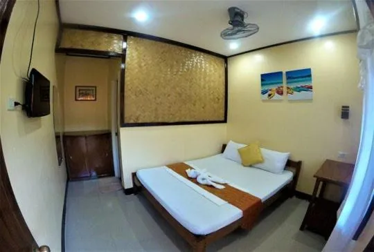 Bed in Telesfora Beach Cottage