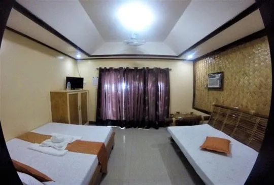 Bed in Telesfora Beach Cottage