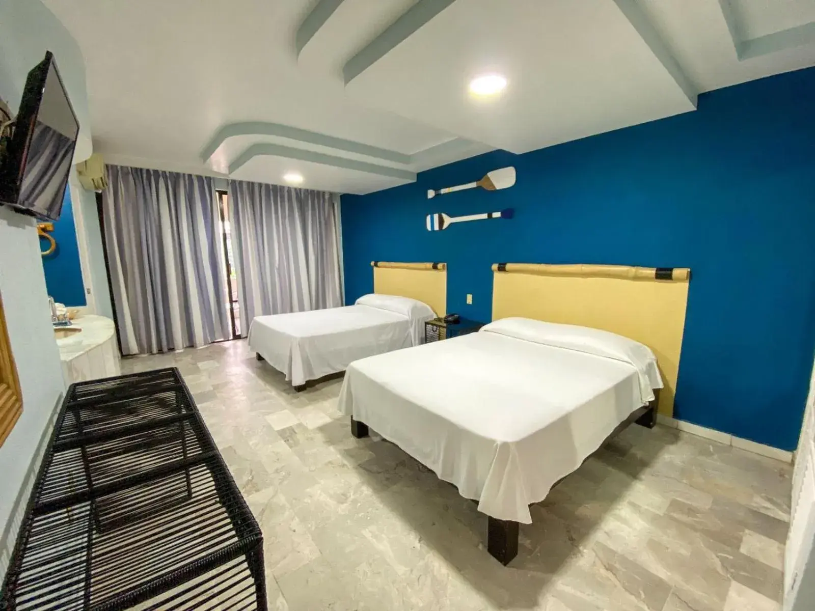 Bed in Acamar Beach Resort Bed in Acamar Beach Resort