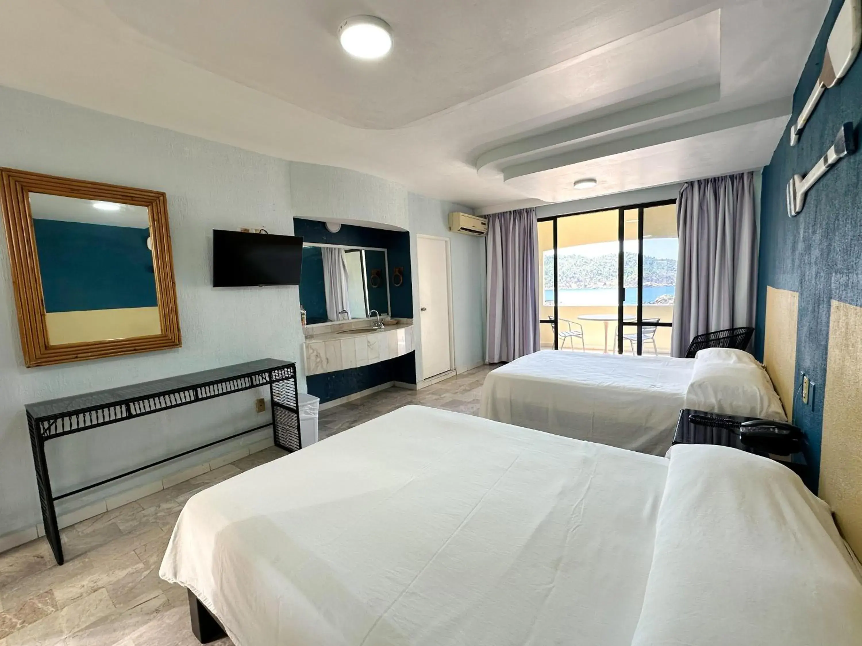 Bed in Acamar Beach Resort Bed in Acamar Beach Resort