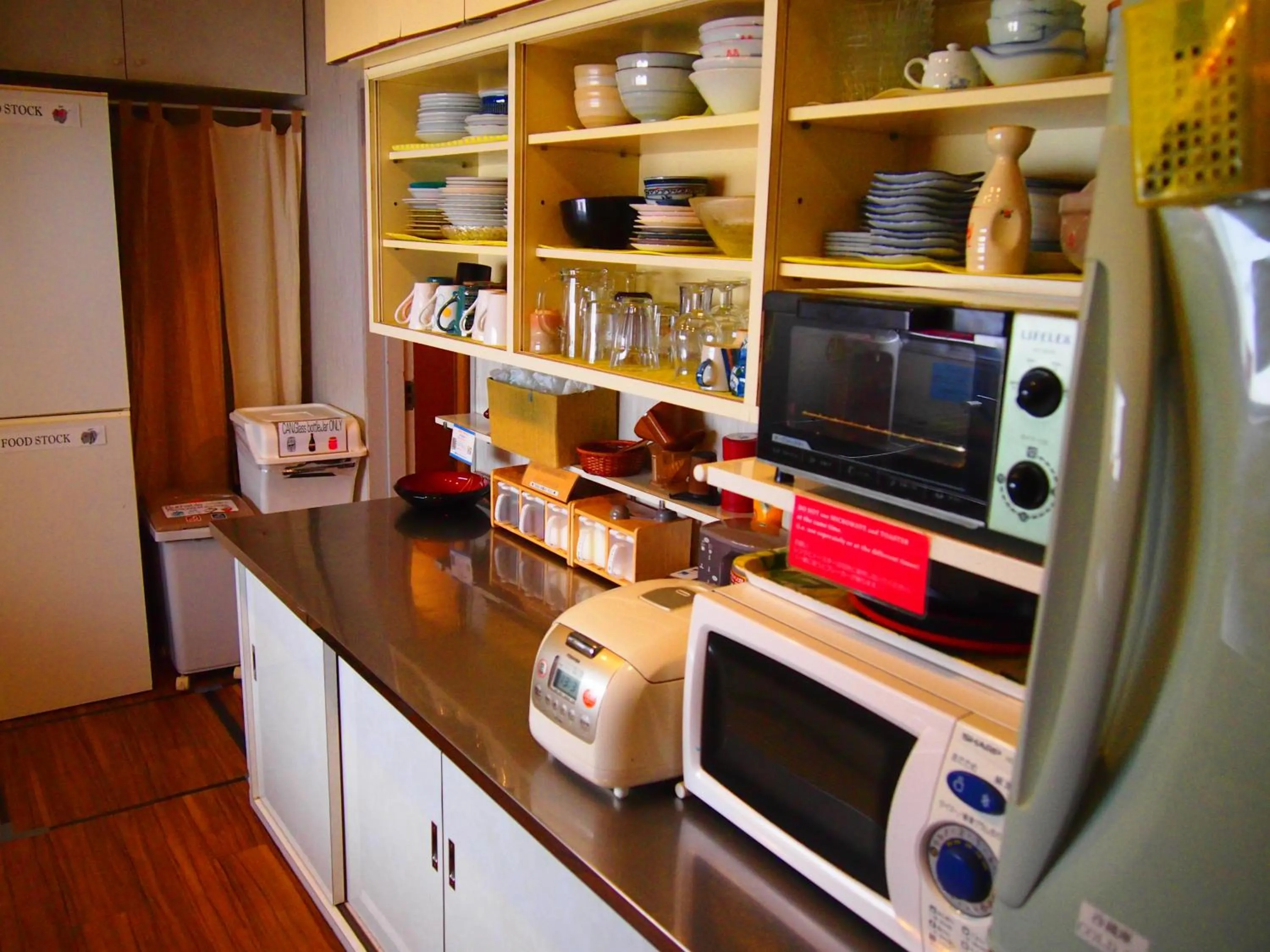 Kitchen or kitchenette in J-Hoppers Hiroshima Guesthouse