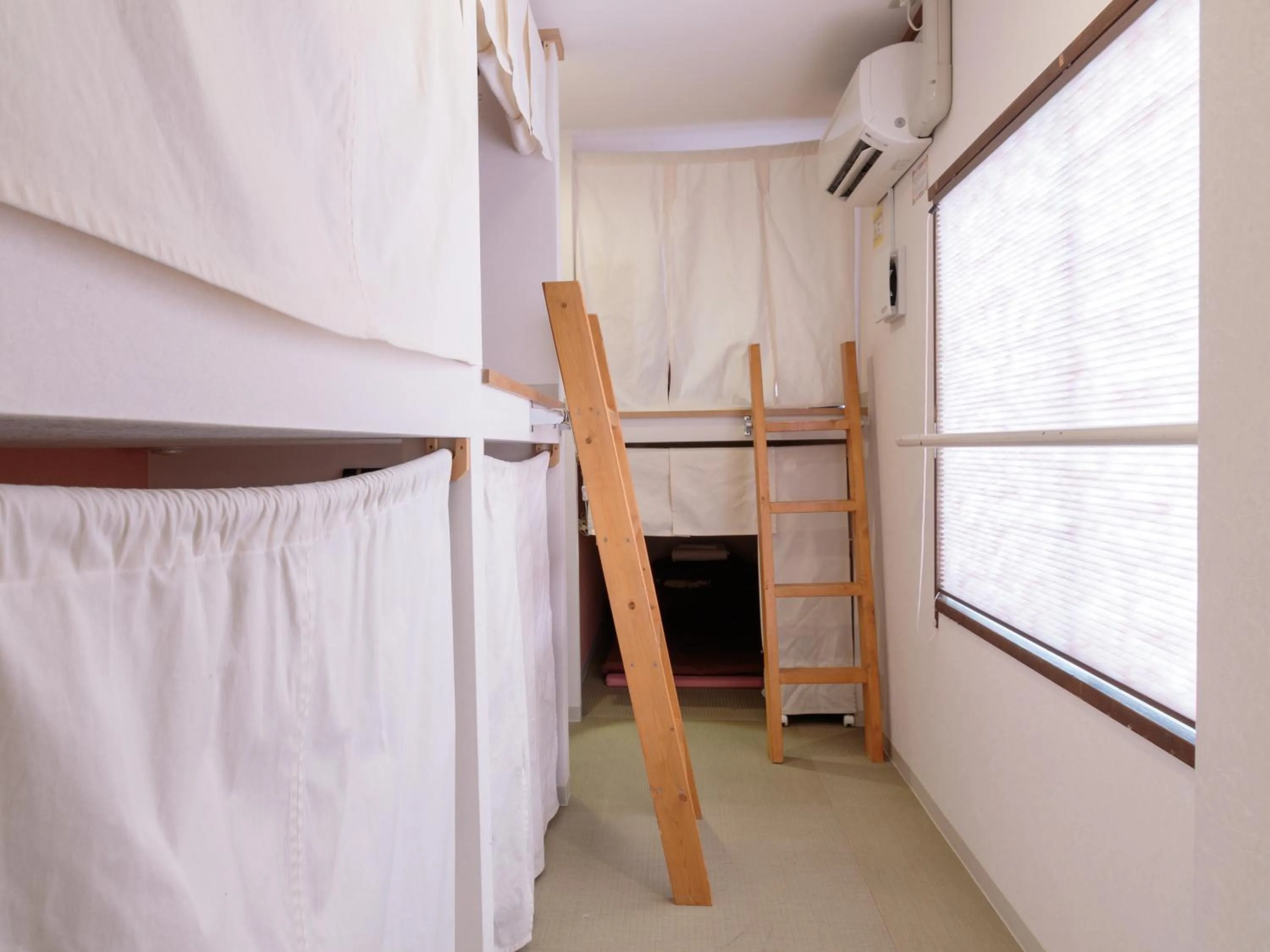 Photo of the whole room, Bed in J-Hoppers Hiroshima Guesthouse