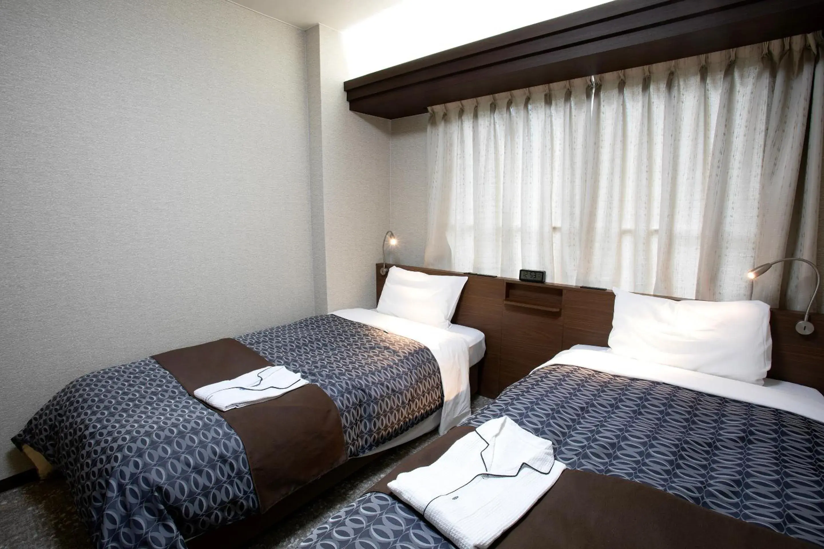 Bed in Nagasaki IK Hotel Bed in Nagasaki IK Hotel