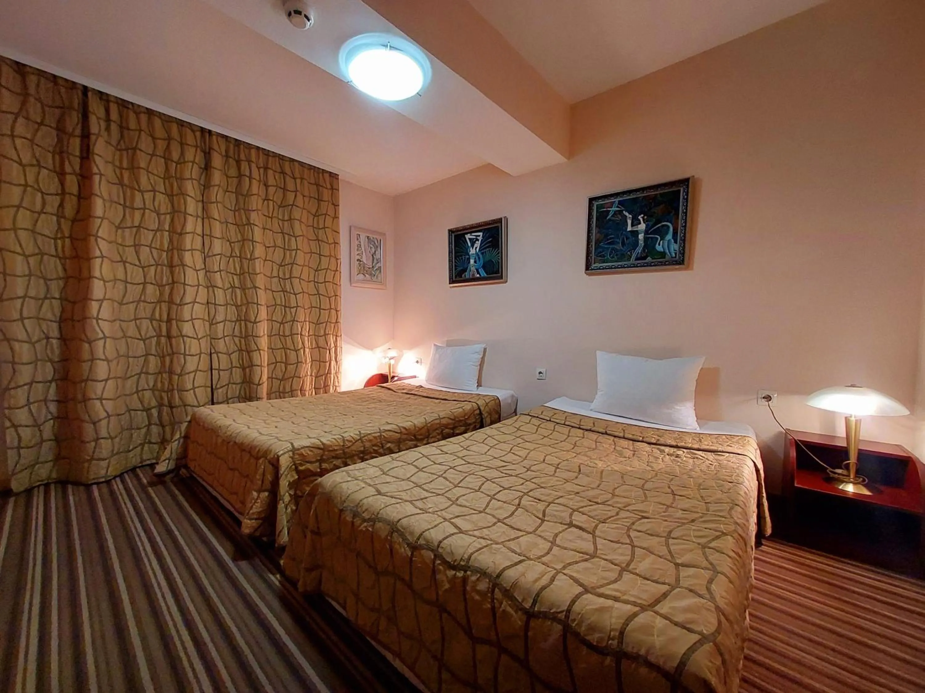 Bed in Family Art Hotel Gallery