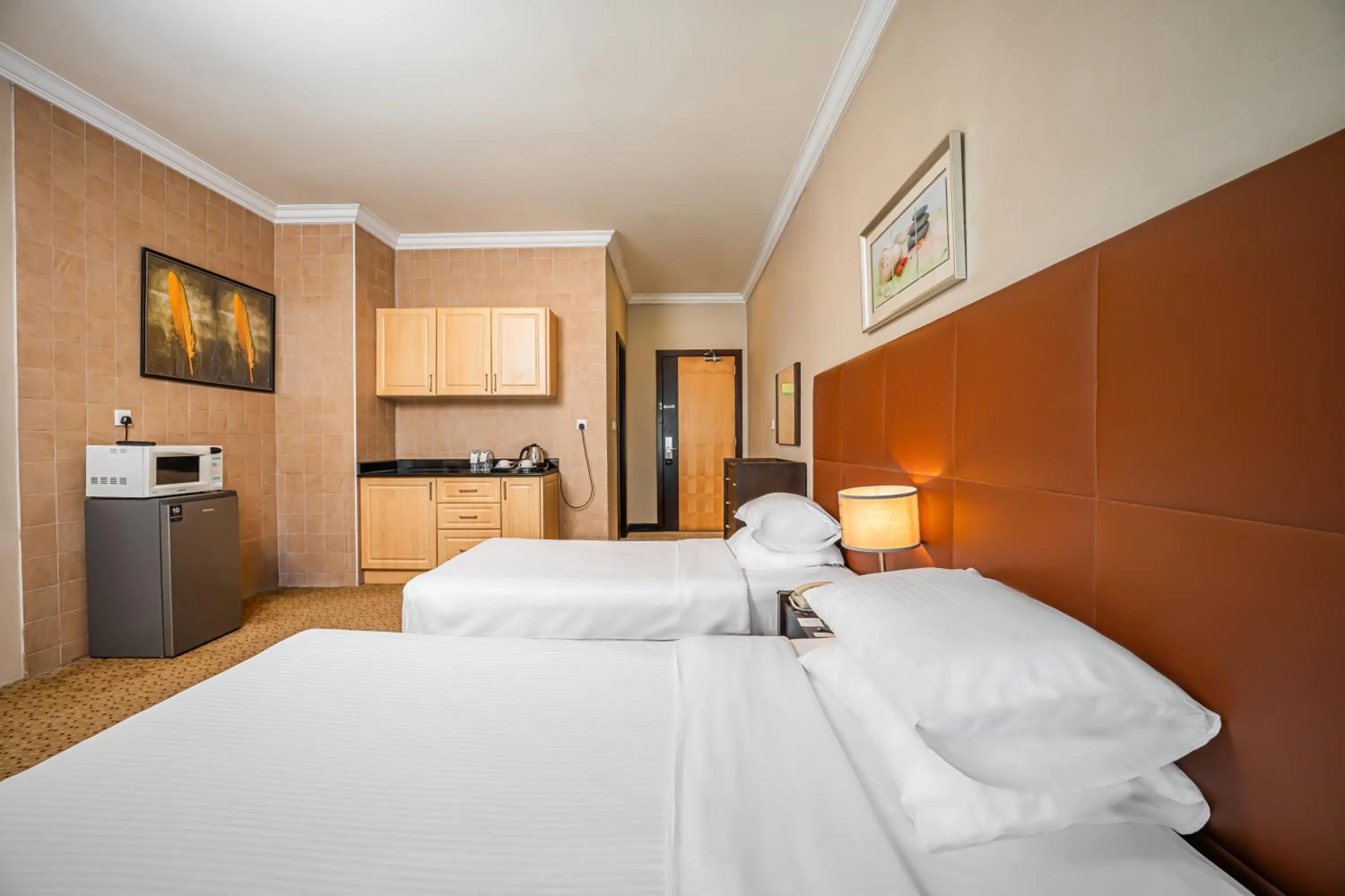 Bed in Kingsgate Hotel Doha by Millennium Hotels