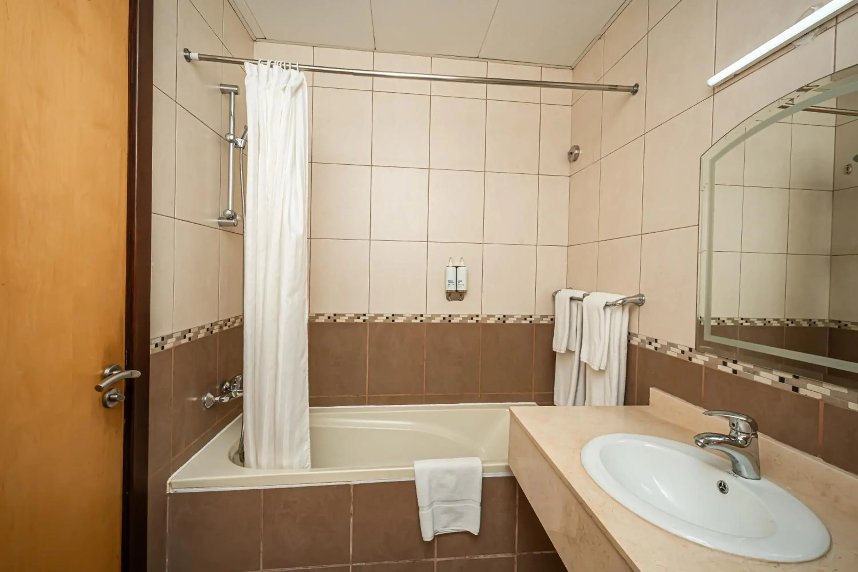 Bathroom in Kingsgate Hotel Doha by Millennium Hotels Bathroom in Kingsgate Hotel Doha by Millennium Hotels