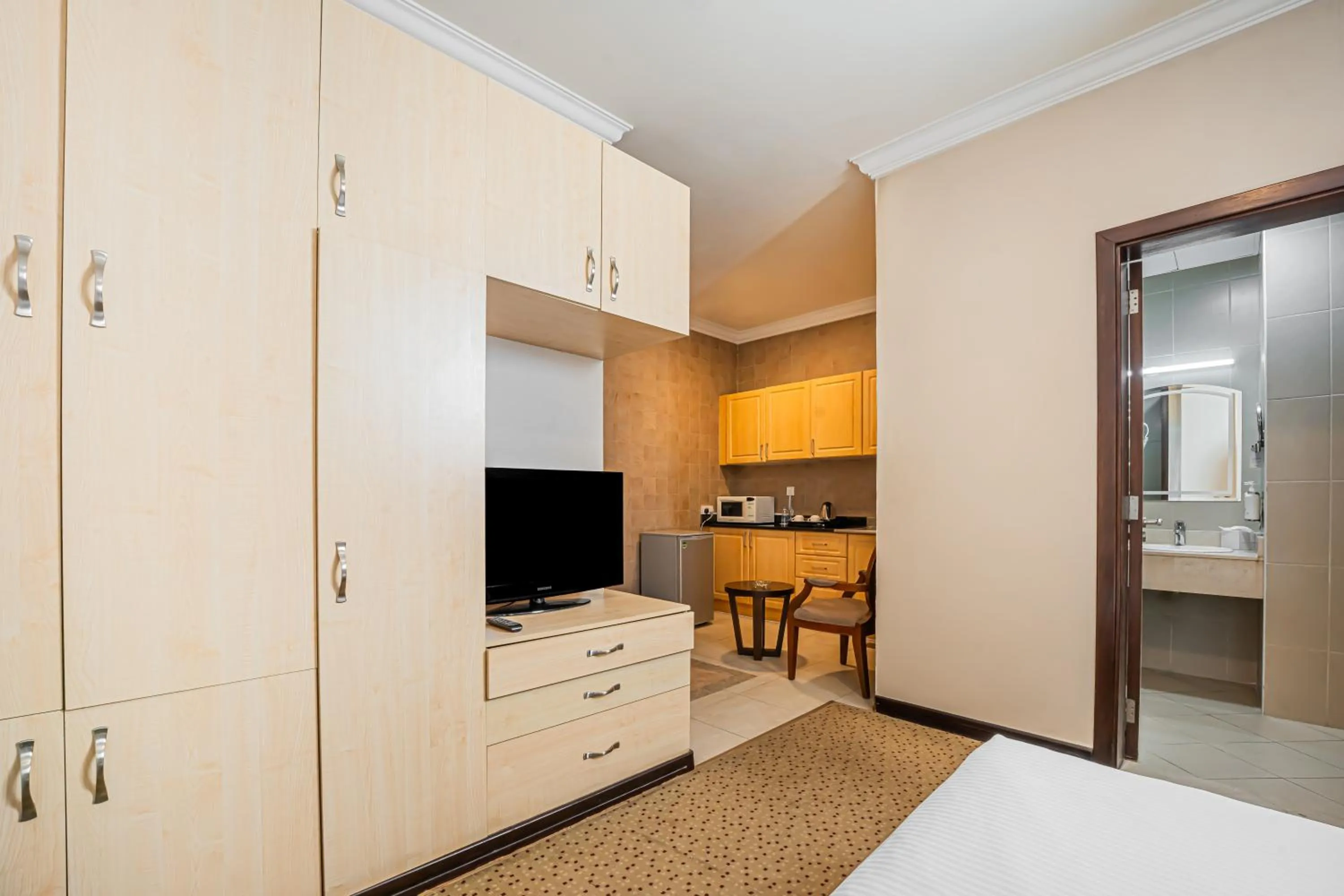 Kitchen or kitchenette in Kingsgate Hotel Doha by Millennium Hotels